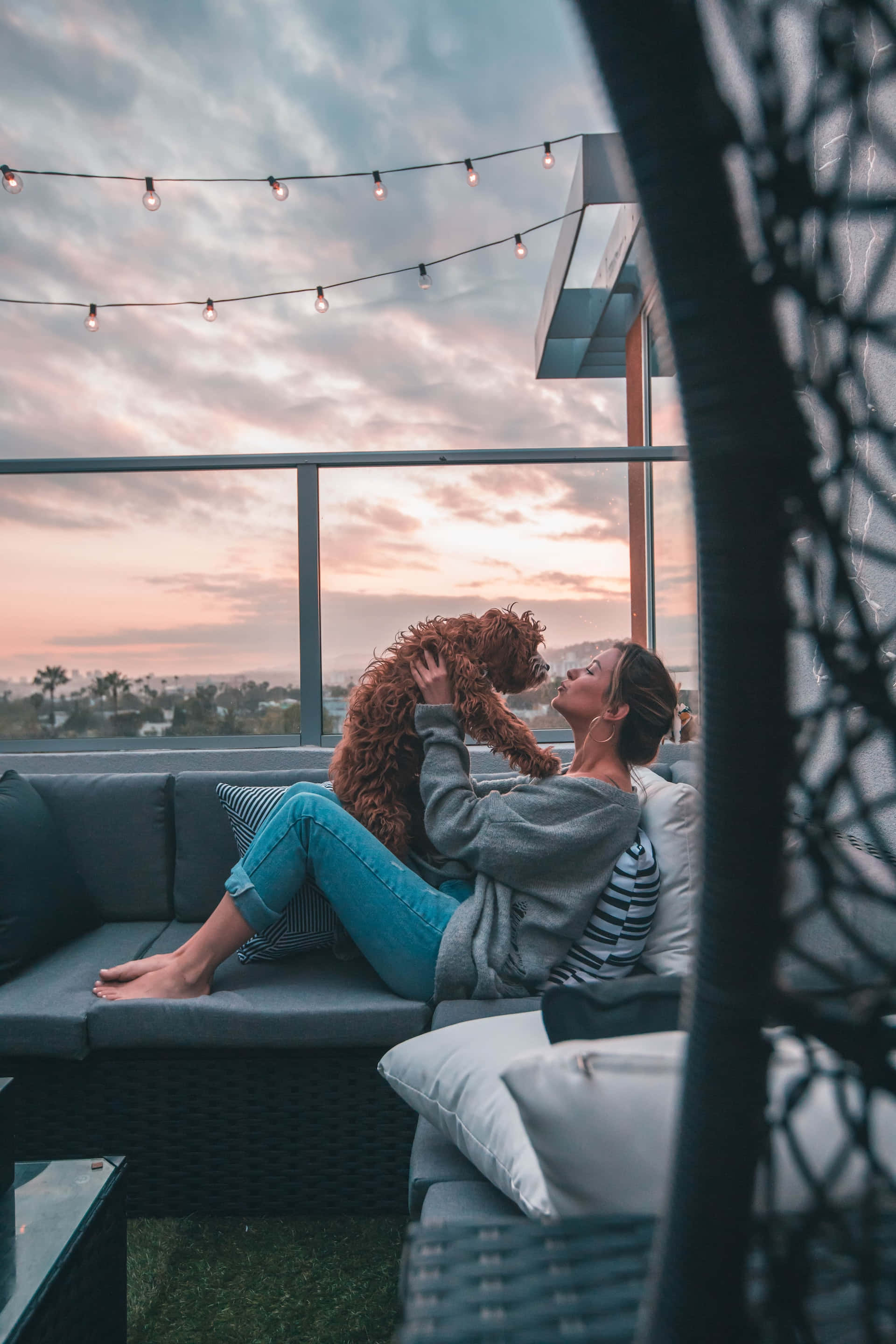 woman, fluffy brown dog, rooftop lounge, 2K Phone Wallpaper