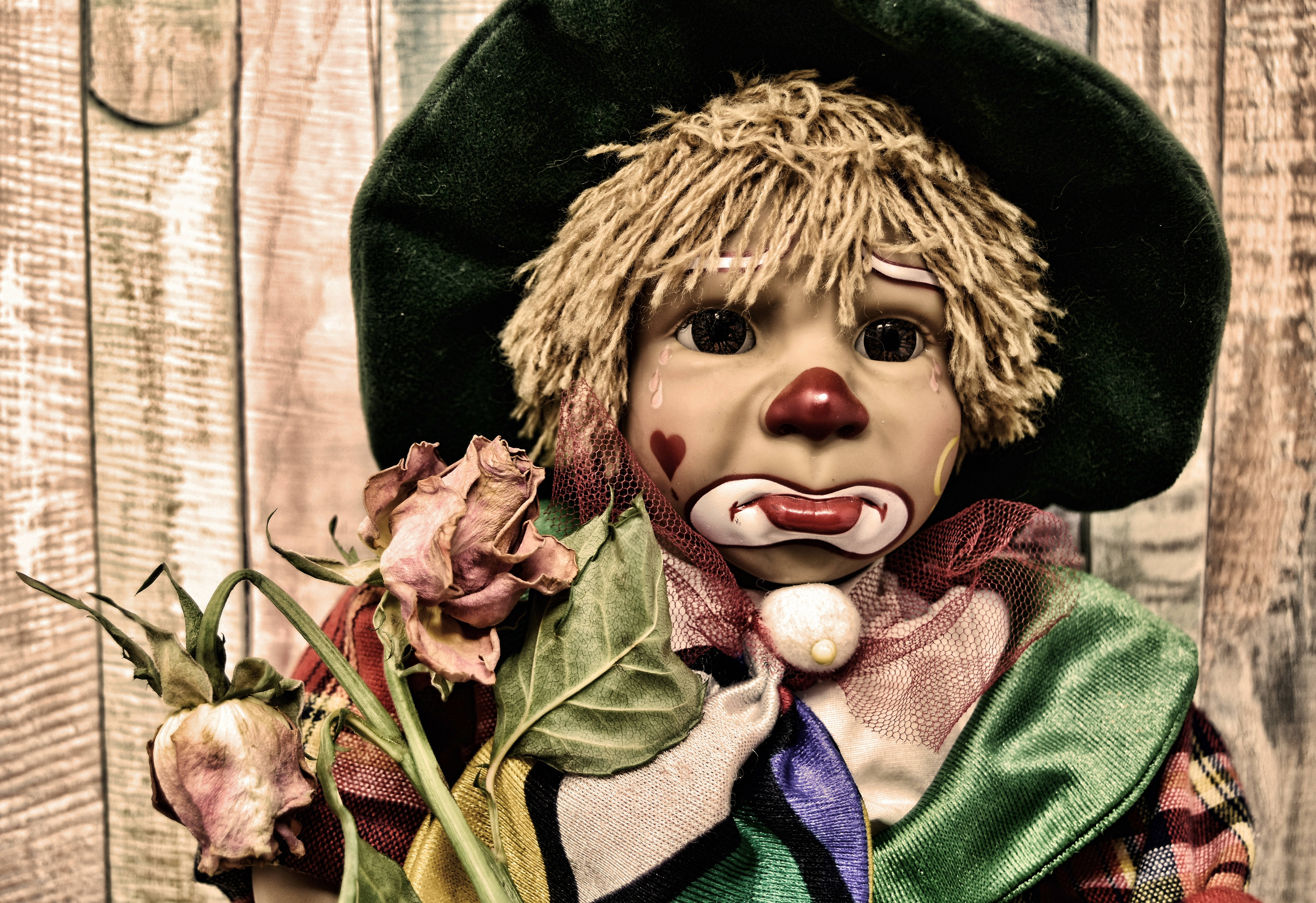 sad clown doll, red nose, tear-streaked face, 5K Desktop Wallpaper