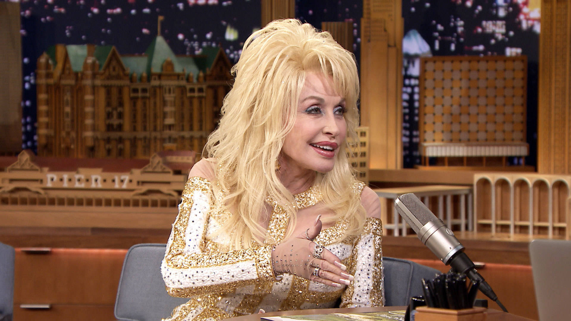 Dolly Parton, glittering gold outfit, talk show desk, Full HD Desktop Wallpaper