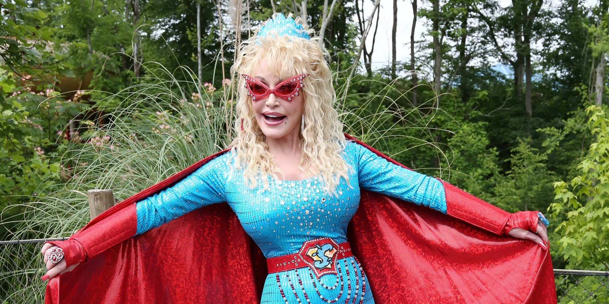 Dolly Parton, sparkling blue superhero costume, red cape, Full HD Desktop Wallpaper