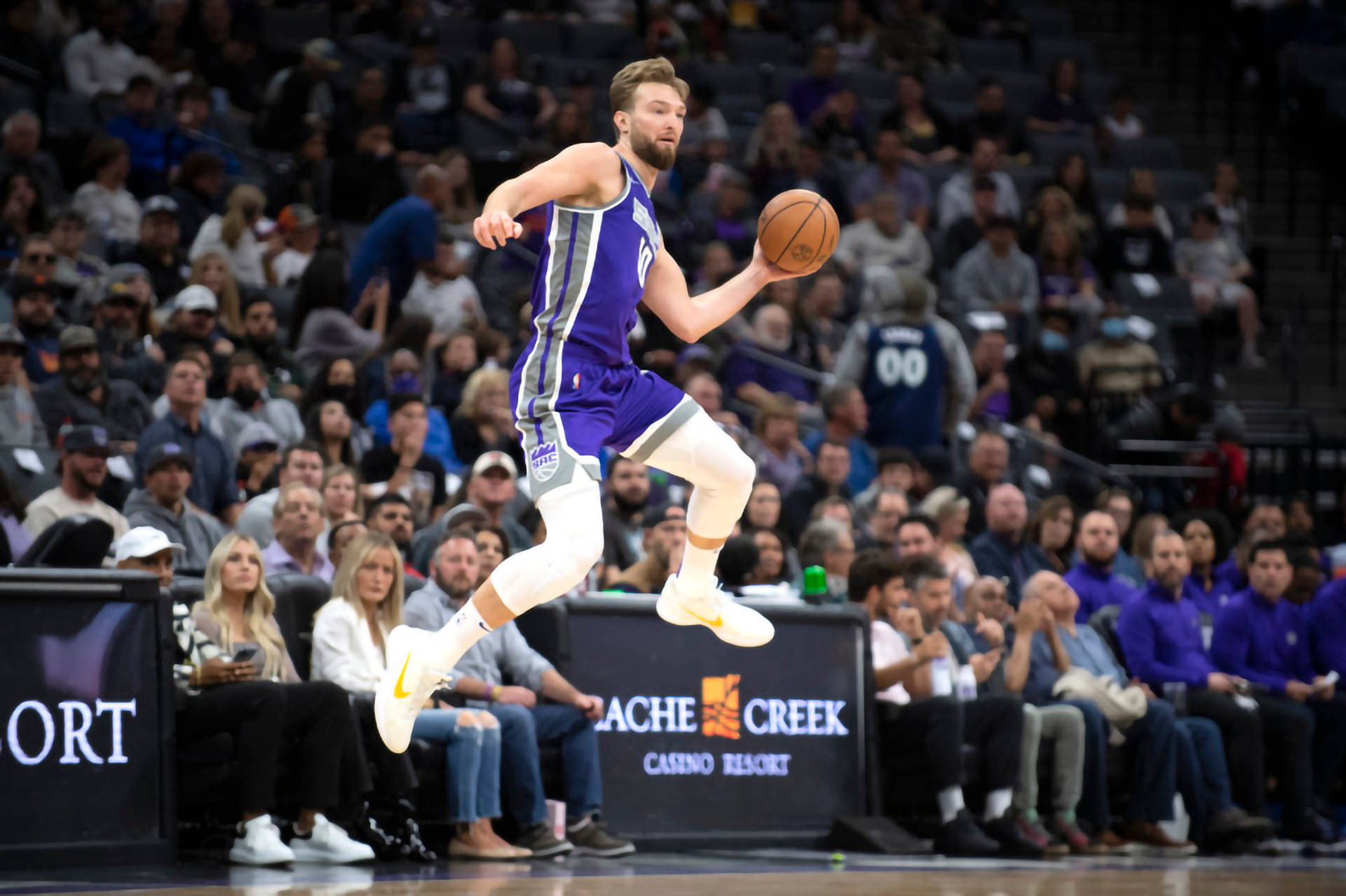 Domantas Sabonis, purple uniform, leaping midair, Full HD Desktop Wallpaper