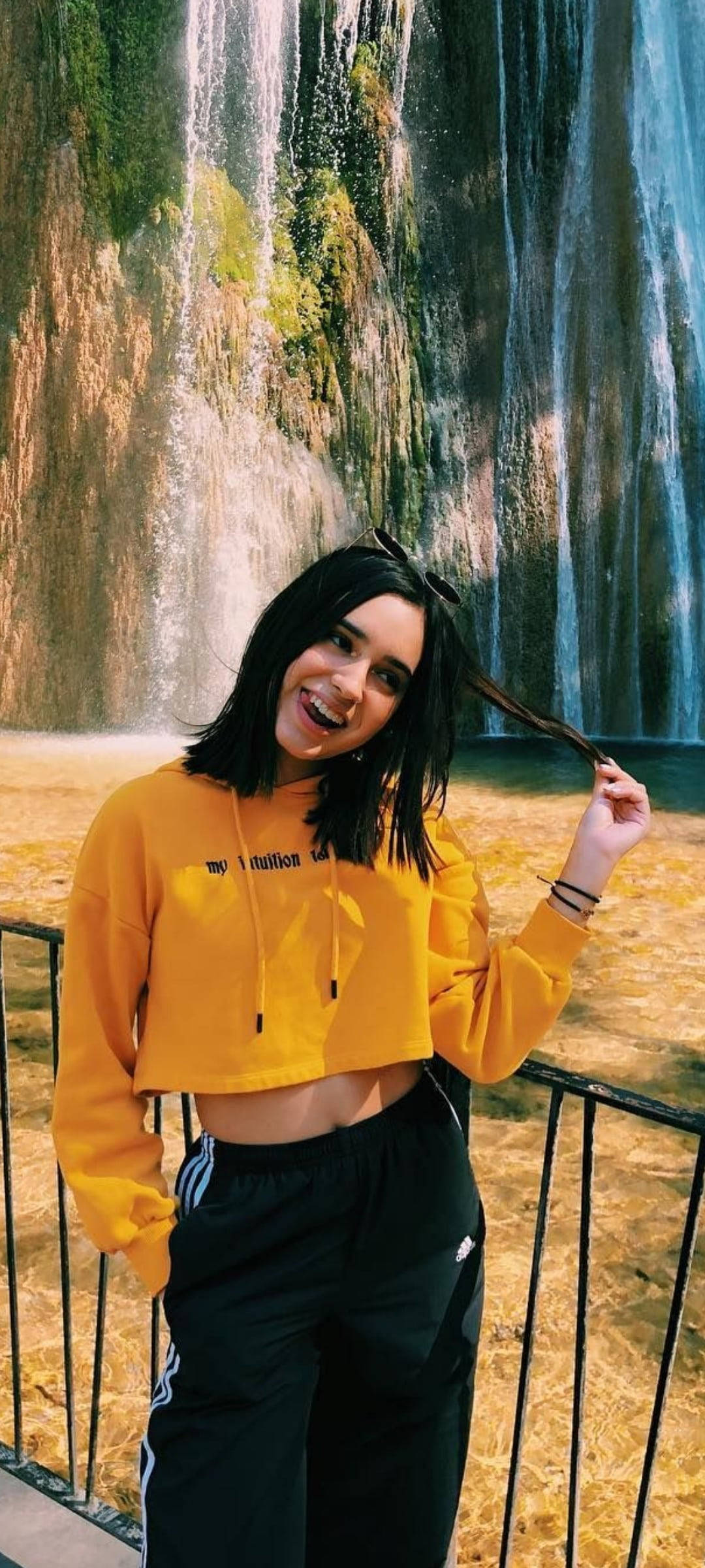 Domelipa, yellow hoodie, cascading waterfall, Full HD Phone Wallpaper