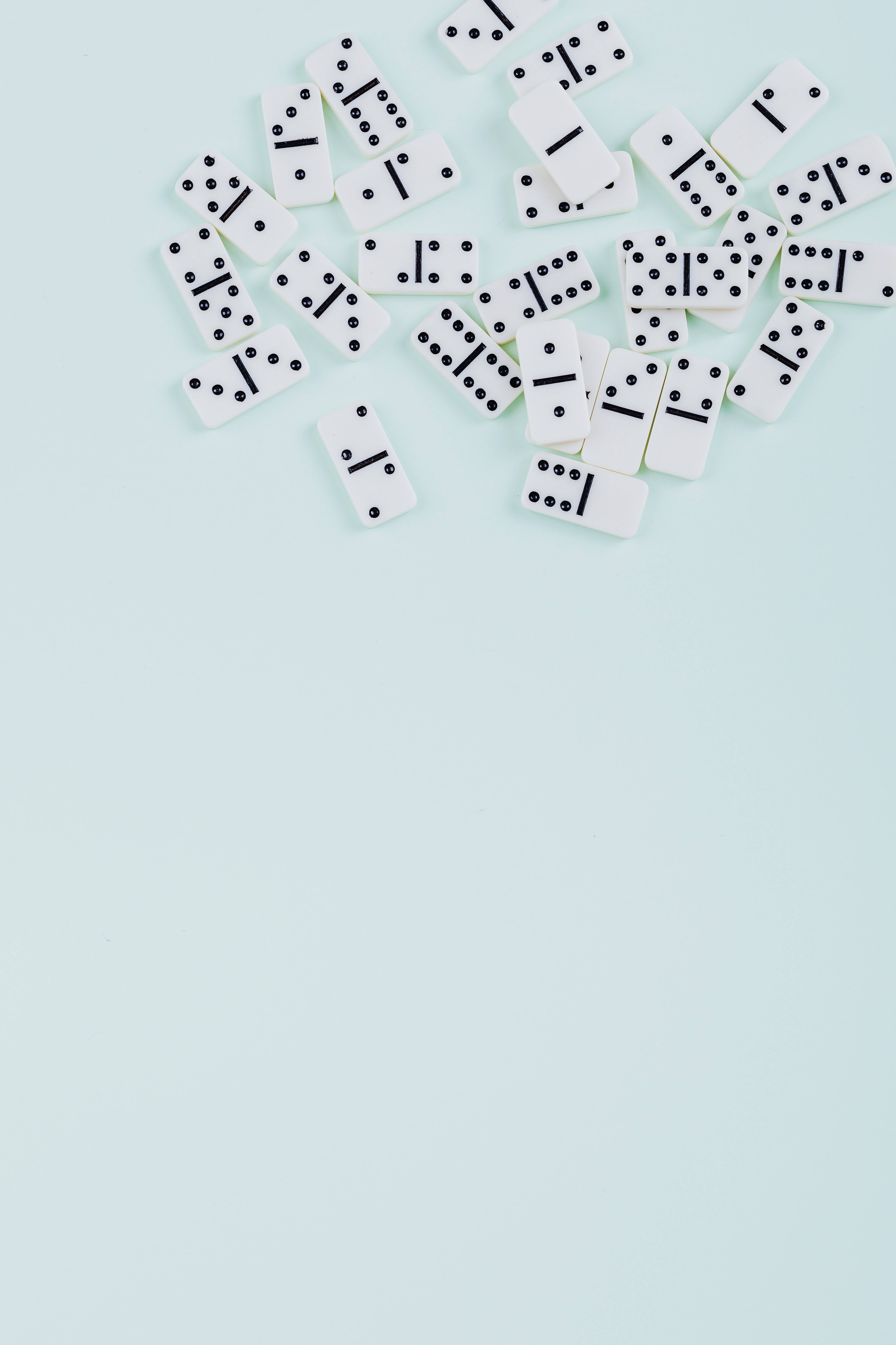 white dominoes, soft mint green background, negative space, 5K Phone Wallpaper