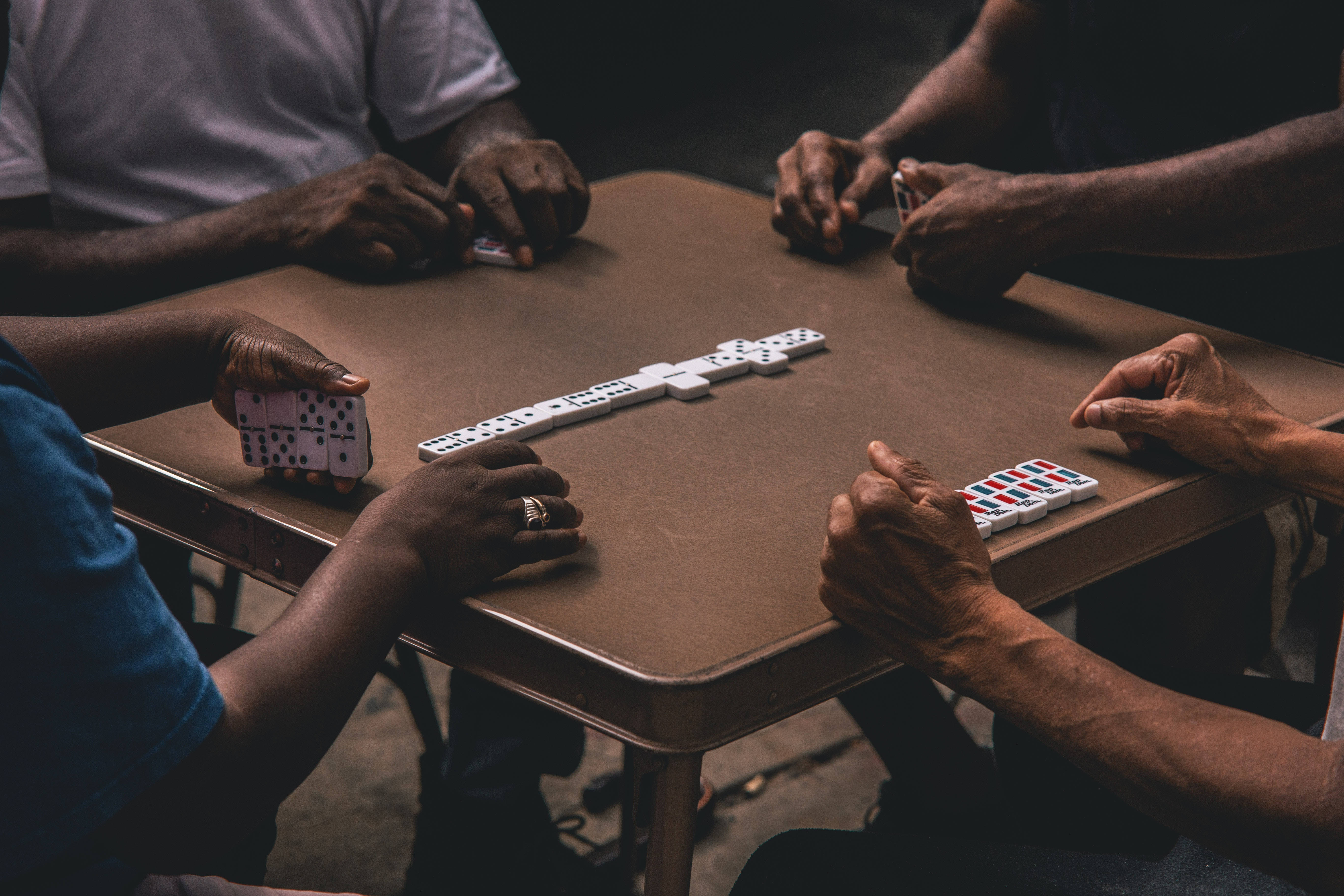 Domino, worn wooden table, dim lighting, 5K Desktop Wallpaper