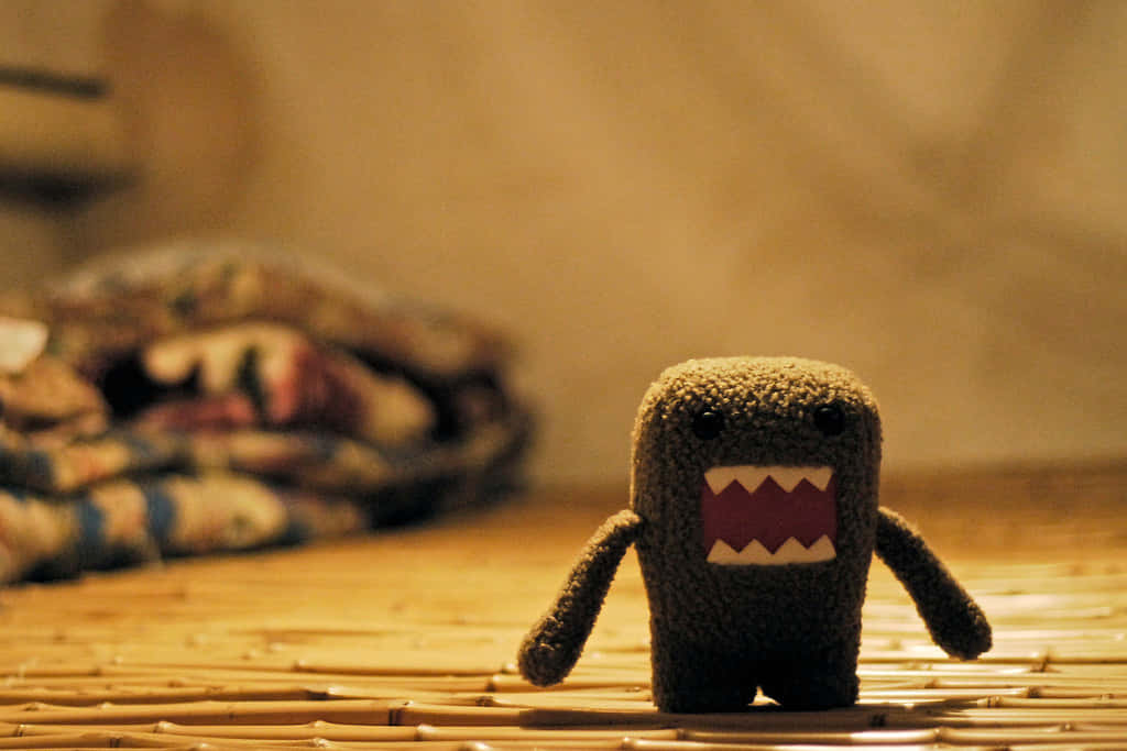 Domo, knitted brown plush toy, wide toothy grin, SD Desktop Wallpaper