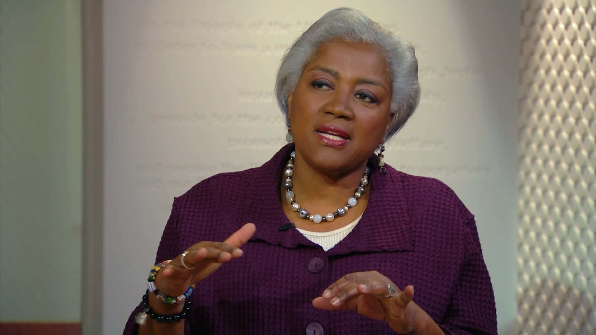 Donna Brazile, insightful speech, softly lit indoor setting, Full HD Desktop Wallpaper