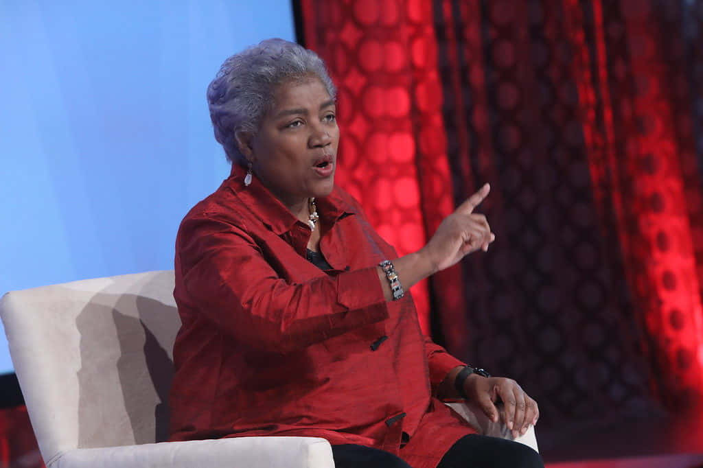 Donna Brazile, red blouse, white chair, SD Desktop Wallpaper