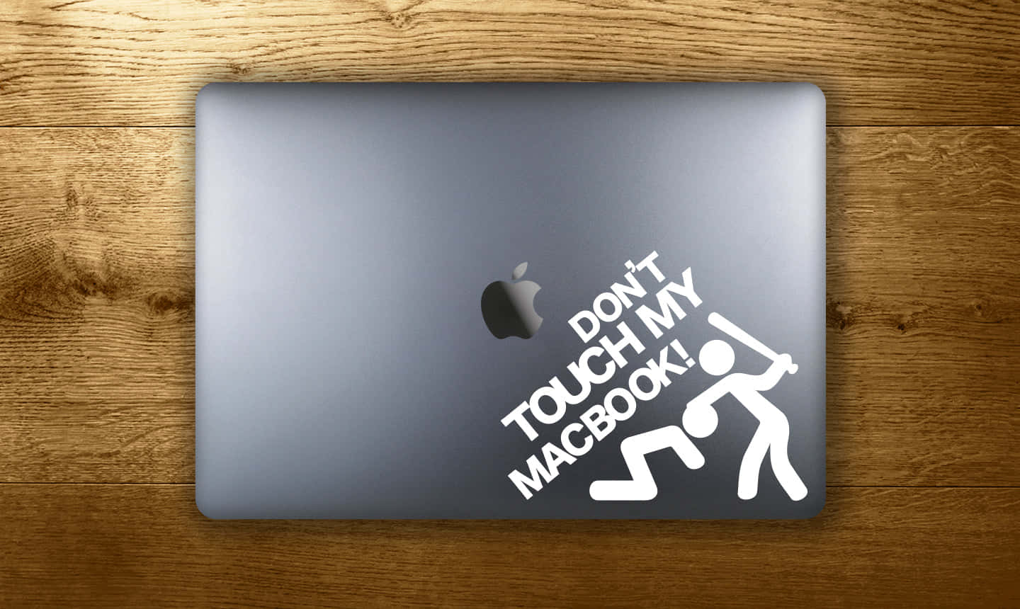 silver MacBook, white 'Don't Touch My Macbook!' sticker, warm wooden surface, HD Desktop Wallpaper