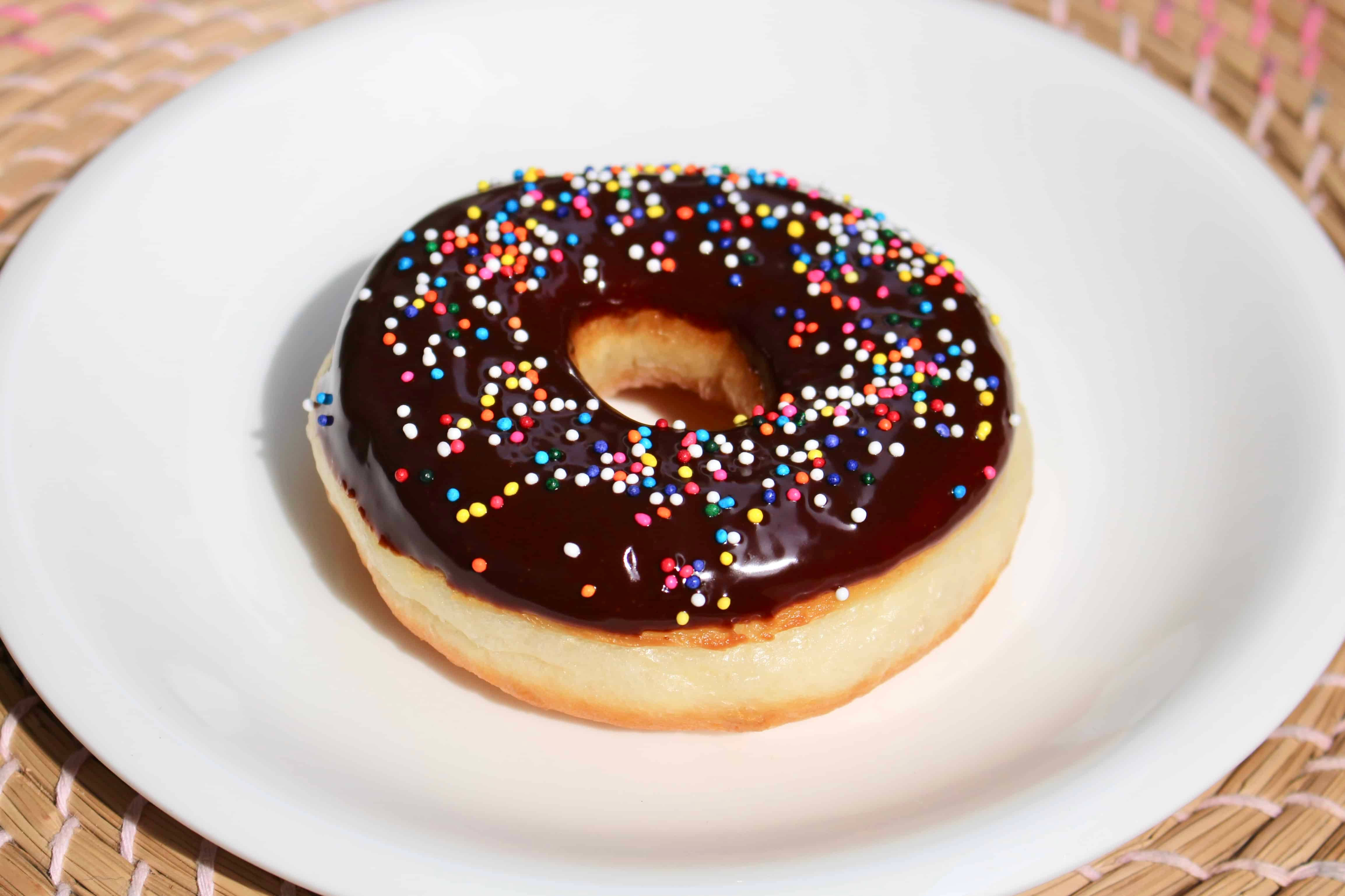 round sprinkles donut, glossy chocolate-glazed, colorful sprinkles, 4K Desktop Wallpaper