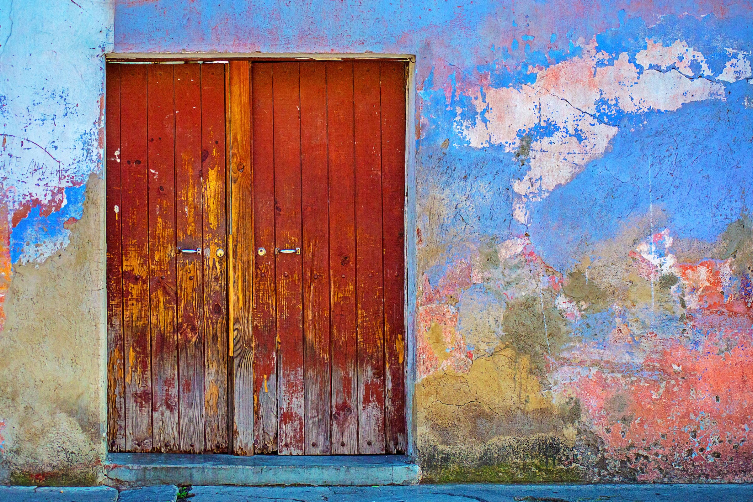 rust yellow hues, red wooden door, vibrant peeling blue and pink wall, Full HD Desktop Wallpaper