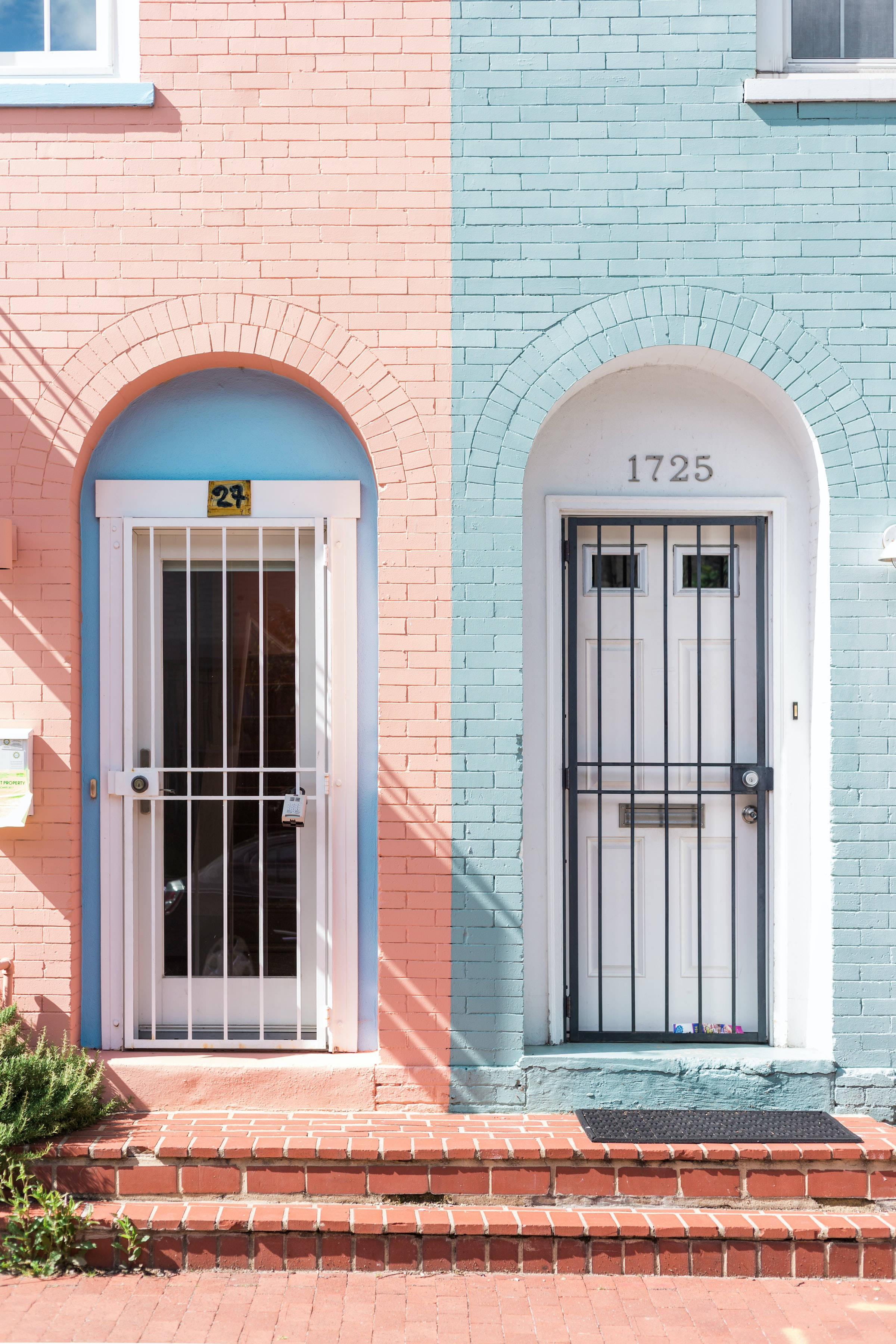 pink and blue walls, white and black doors, brick townhouses, 2K Phone Wallpaper