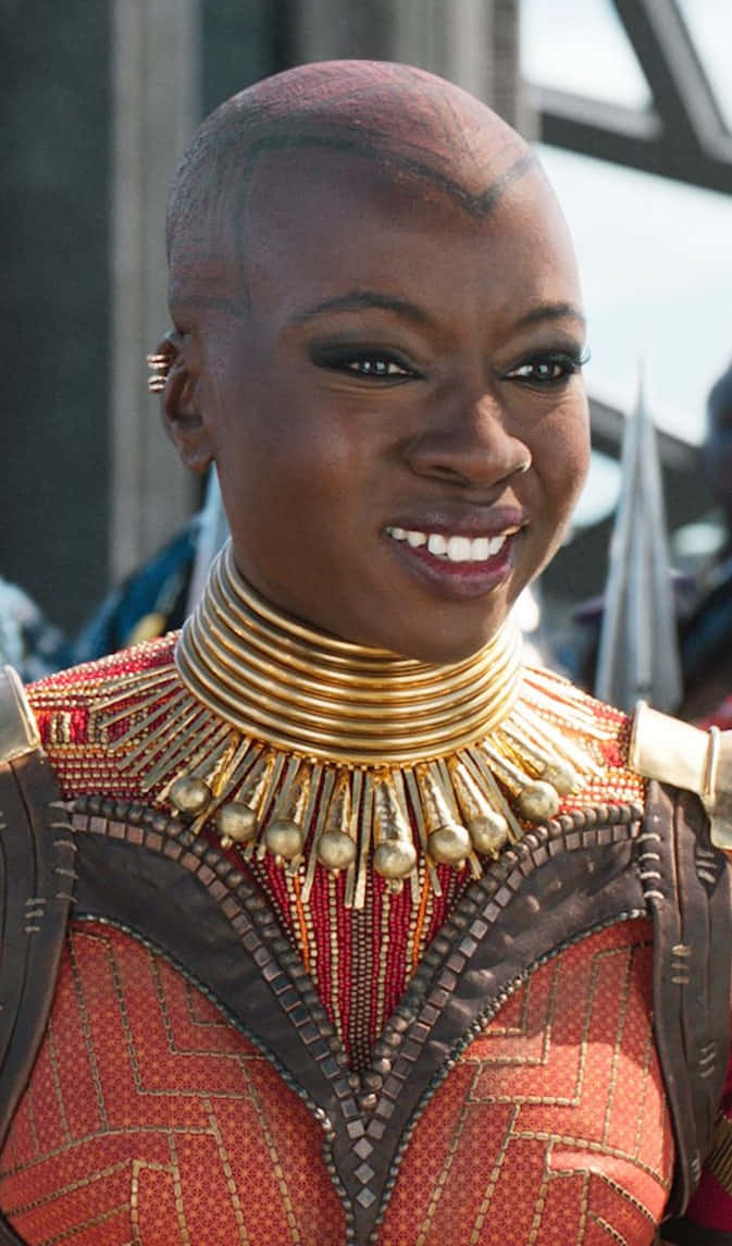 Dora Milaje, red and gold ceremonial armor, shaved head, SD Phone Wallpaper