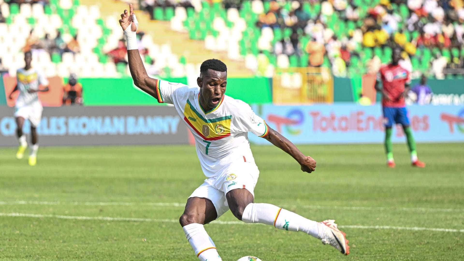 soccer player, white jersey with green yellow and red accents, vibrant green field, Full HD Desktop Wallpaper