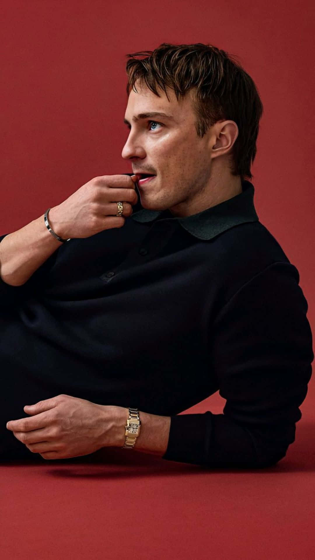 Drew Starkey, black polo shirt, solid red background, Full HD Phone Wallpaper