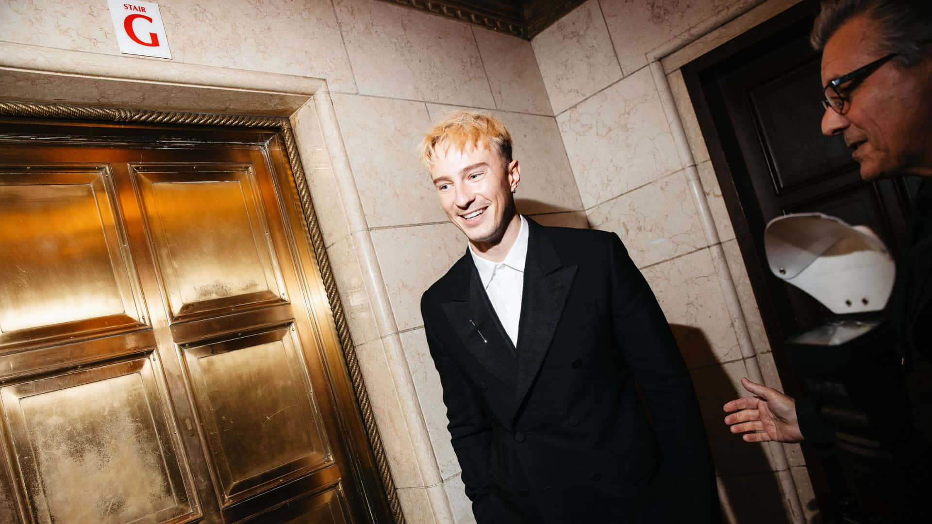 Drew Starkey, black suit, golden elevator door, Full HD Desktop Wallpaper