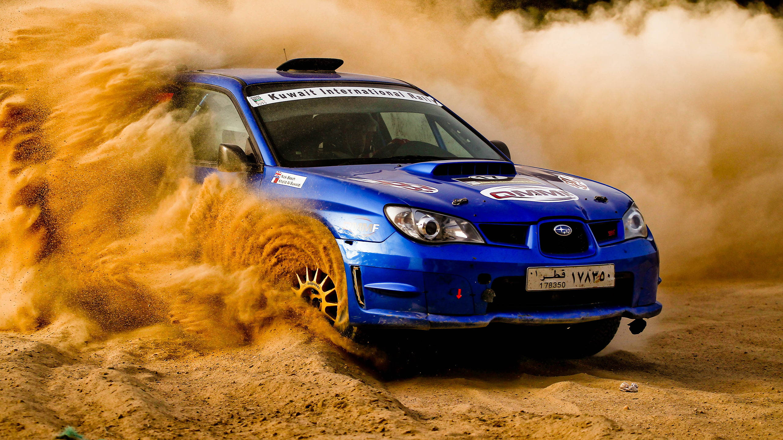 vibrant blue rally car, golden sand, desert race, 2K Desktop Wallpaper