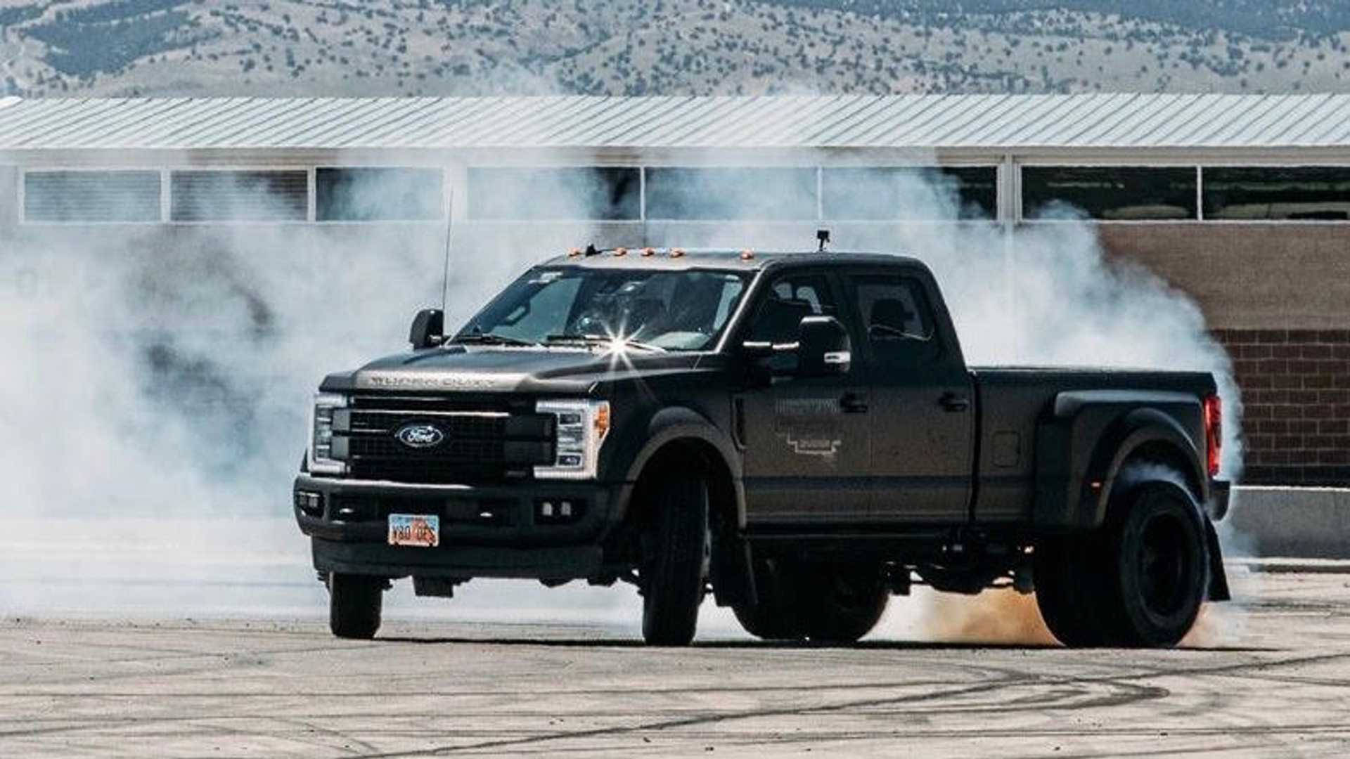 black Ford F-150, asphalt lot, mountains, Full HD Desktop Wallpaper
