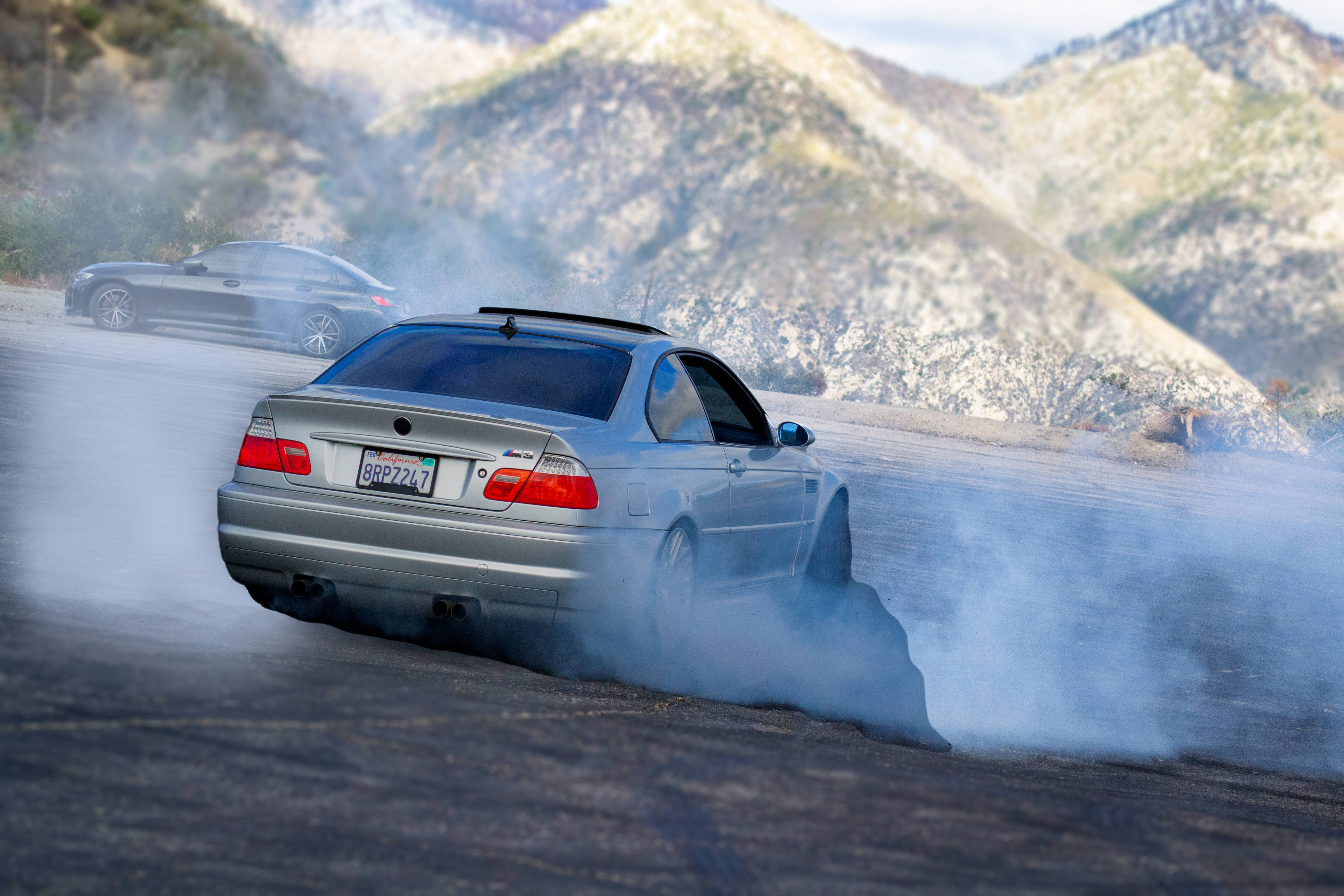 silver sports car, mountain road, drifts in smoke, 4K Desktop Wallpaper