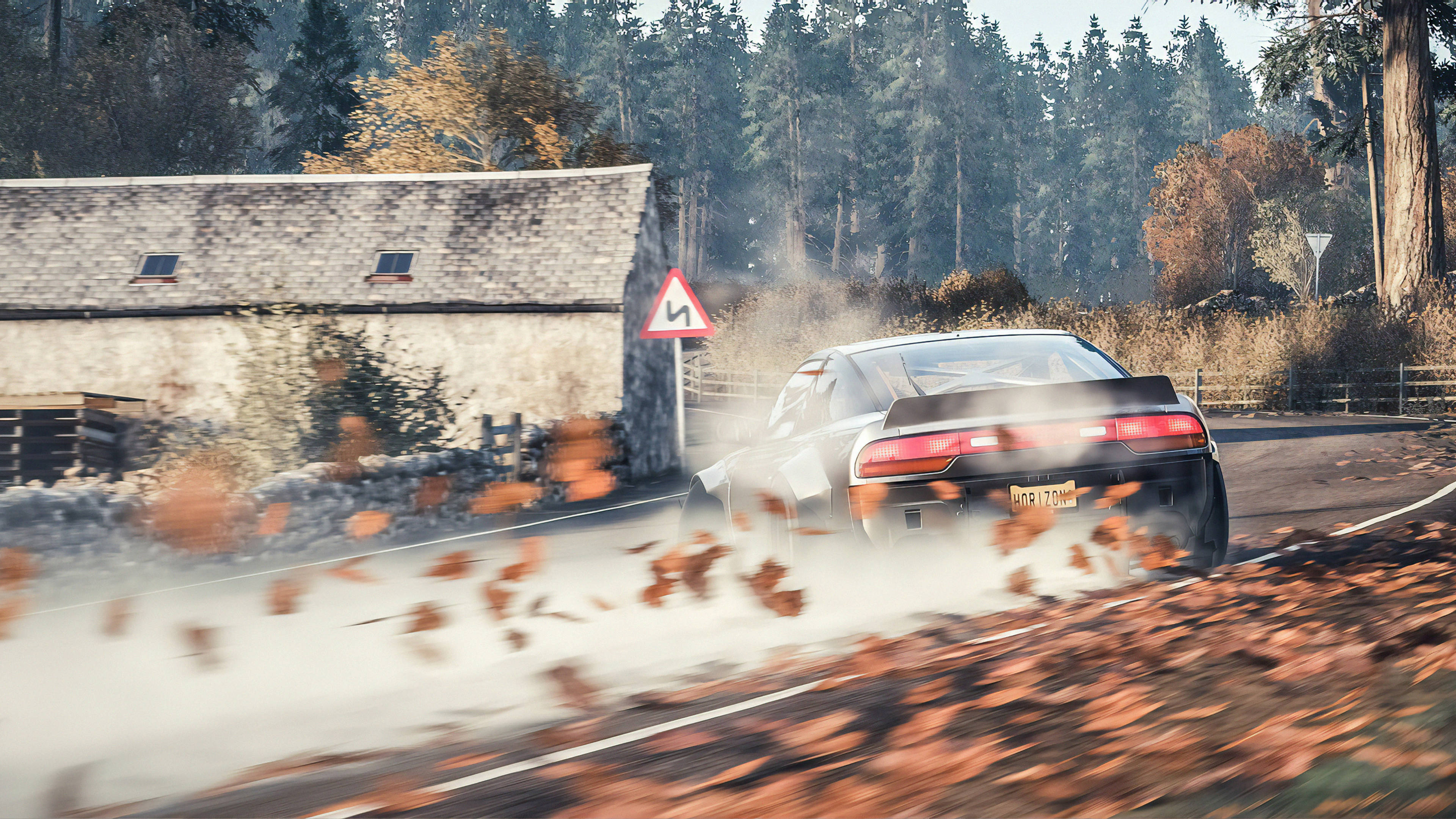 black sports car, autumn leaves, forested bend, 4K Desktop Wallpaper