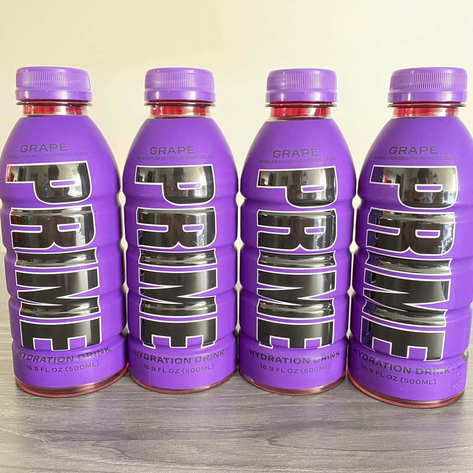 Prime hydration drink, purple grape-flavored, gray wooden surface, HD Desktop Wallpaper