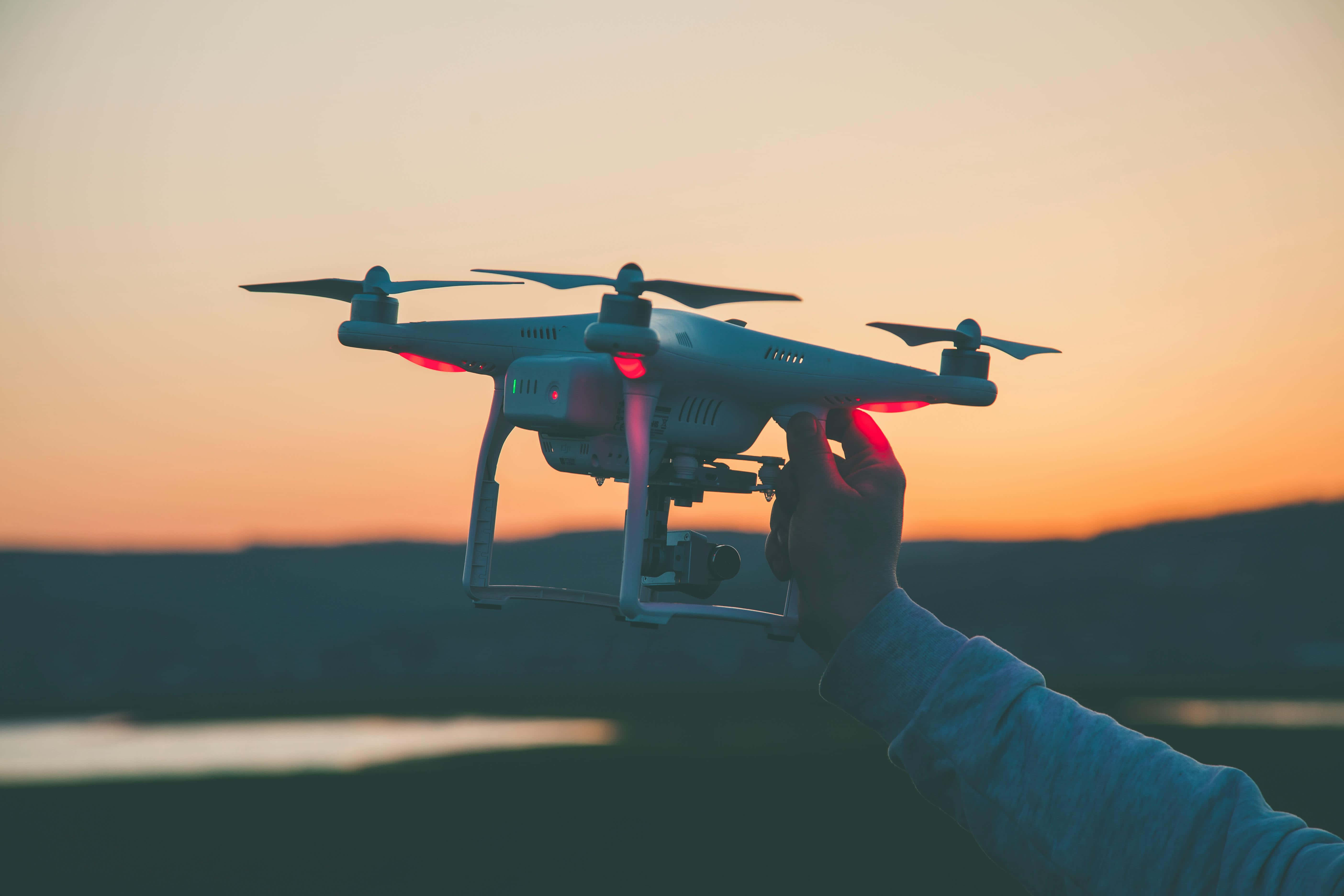 drone, sunset, glowing red lights, 5K Desktop Wallpaper