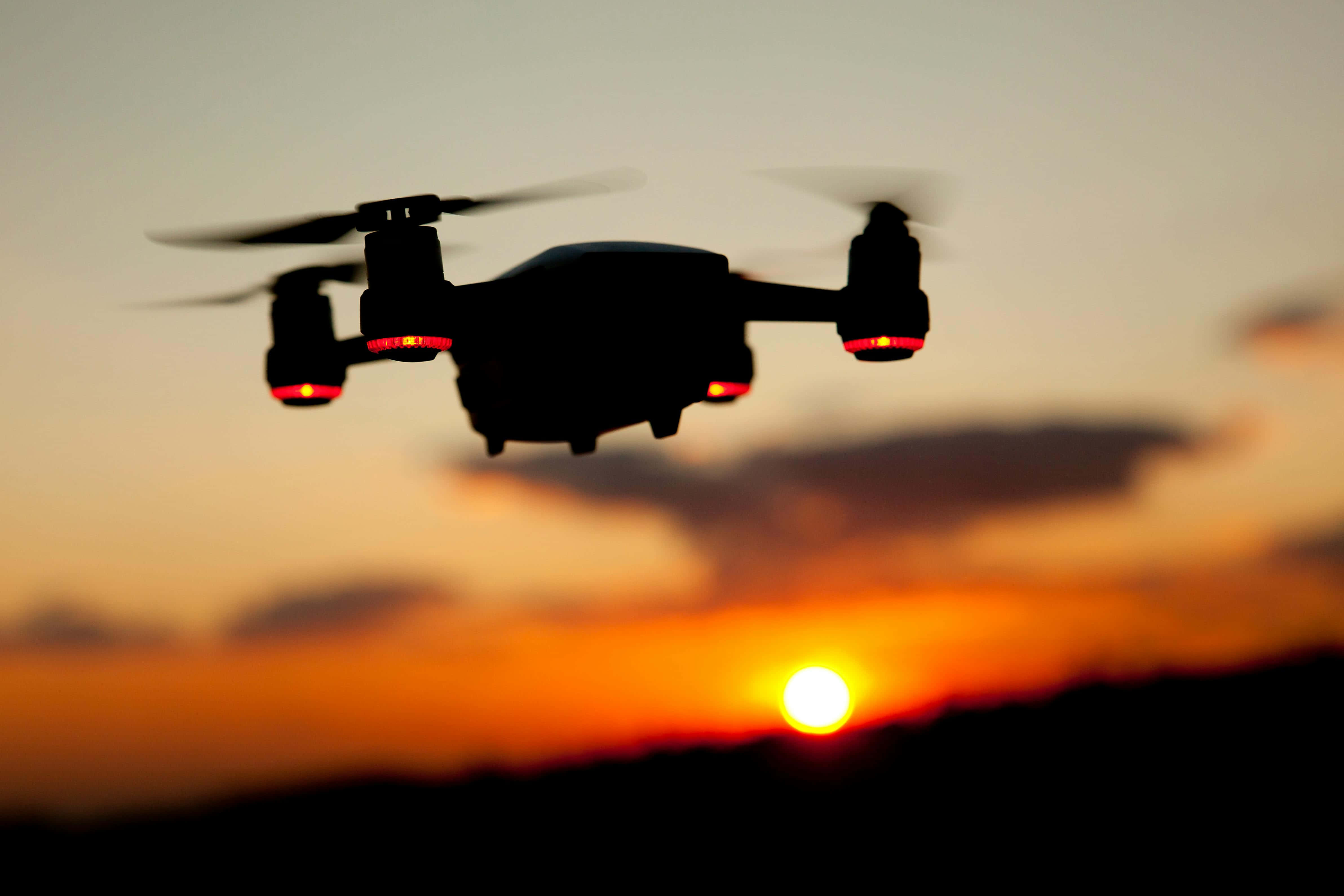 drone, silhouetted, sunset sky, 4K Desktop Wallpaper