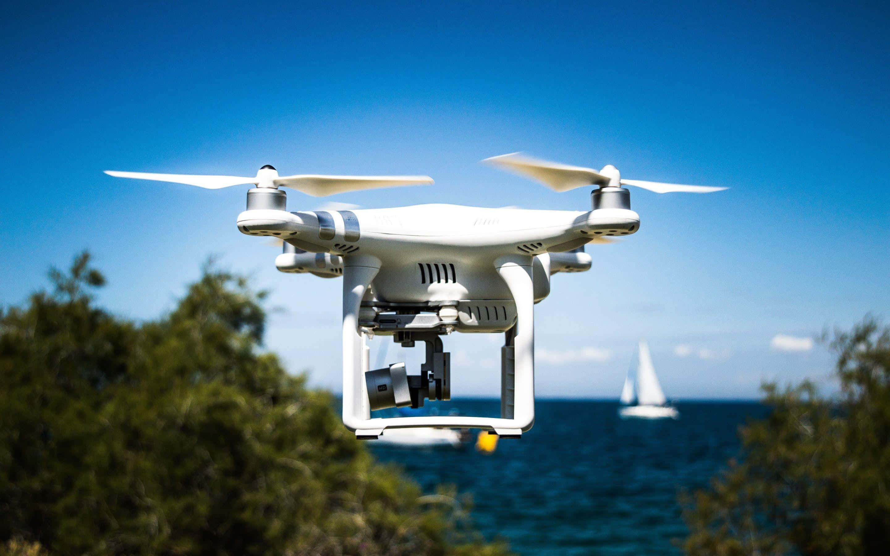 white drone, coastal waters, sailboat, 2K Desktop Wallpaper