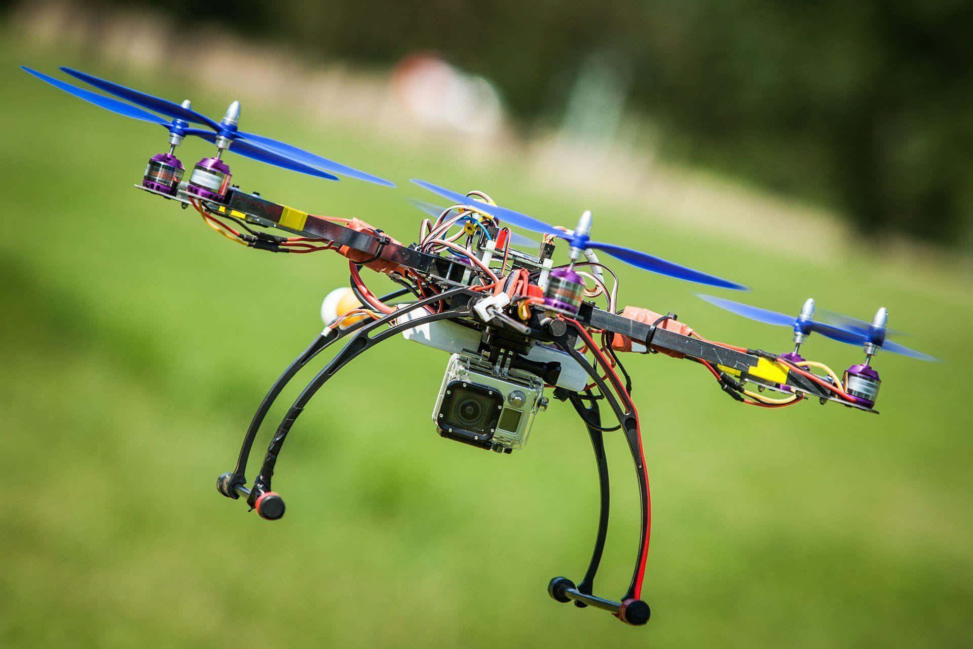 custom built drone, blue propellers, lush green field, Full HD Desktop Wallpaper