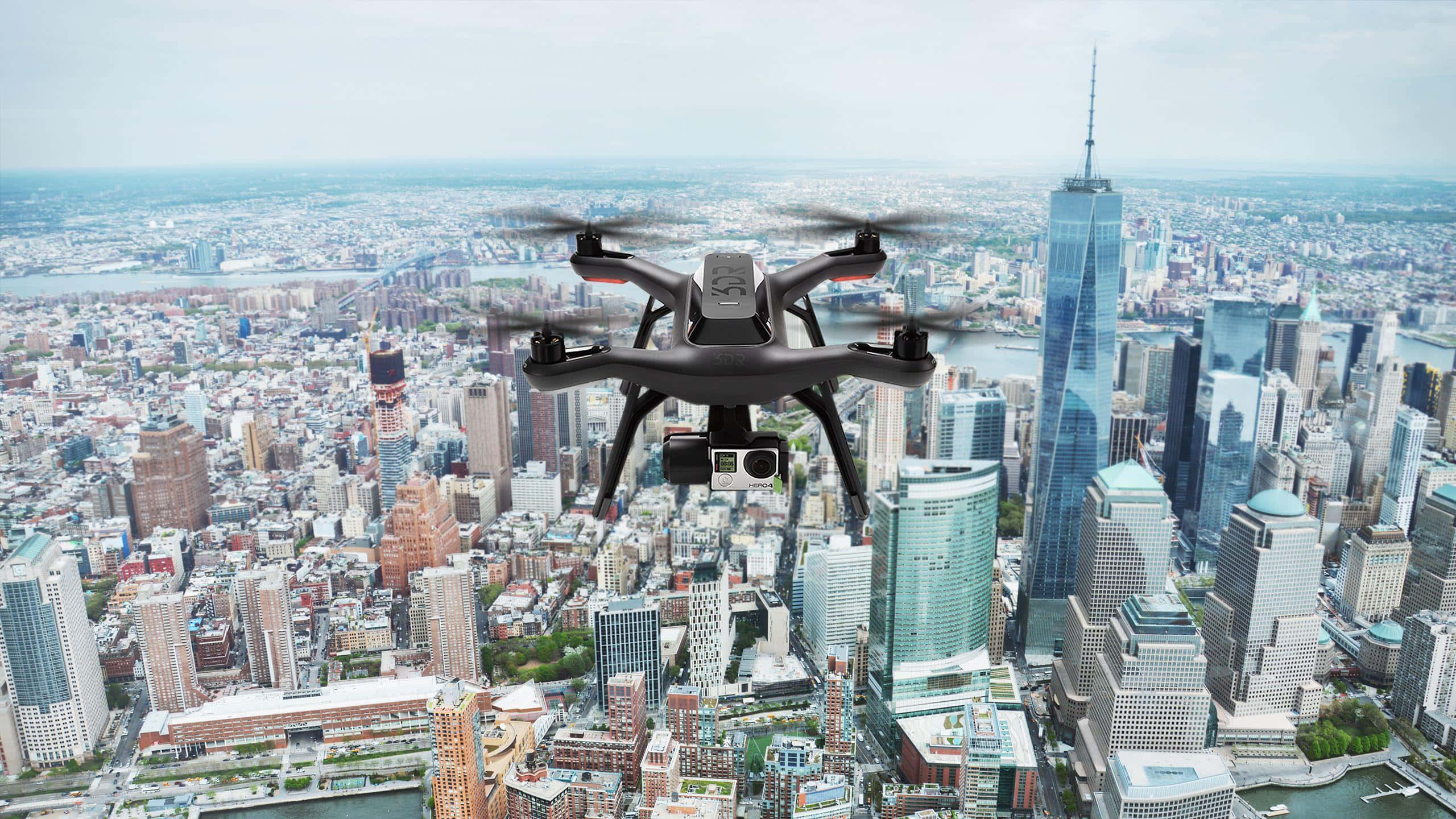 black quadcopter drone, urban skyline, glass skyscrapers, 2K Desktop Wallpaper
