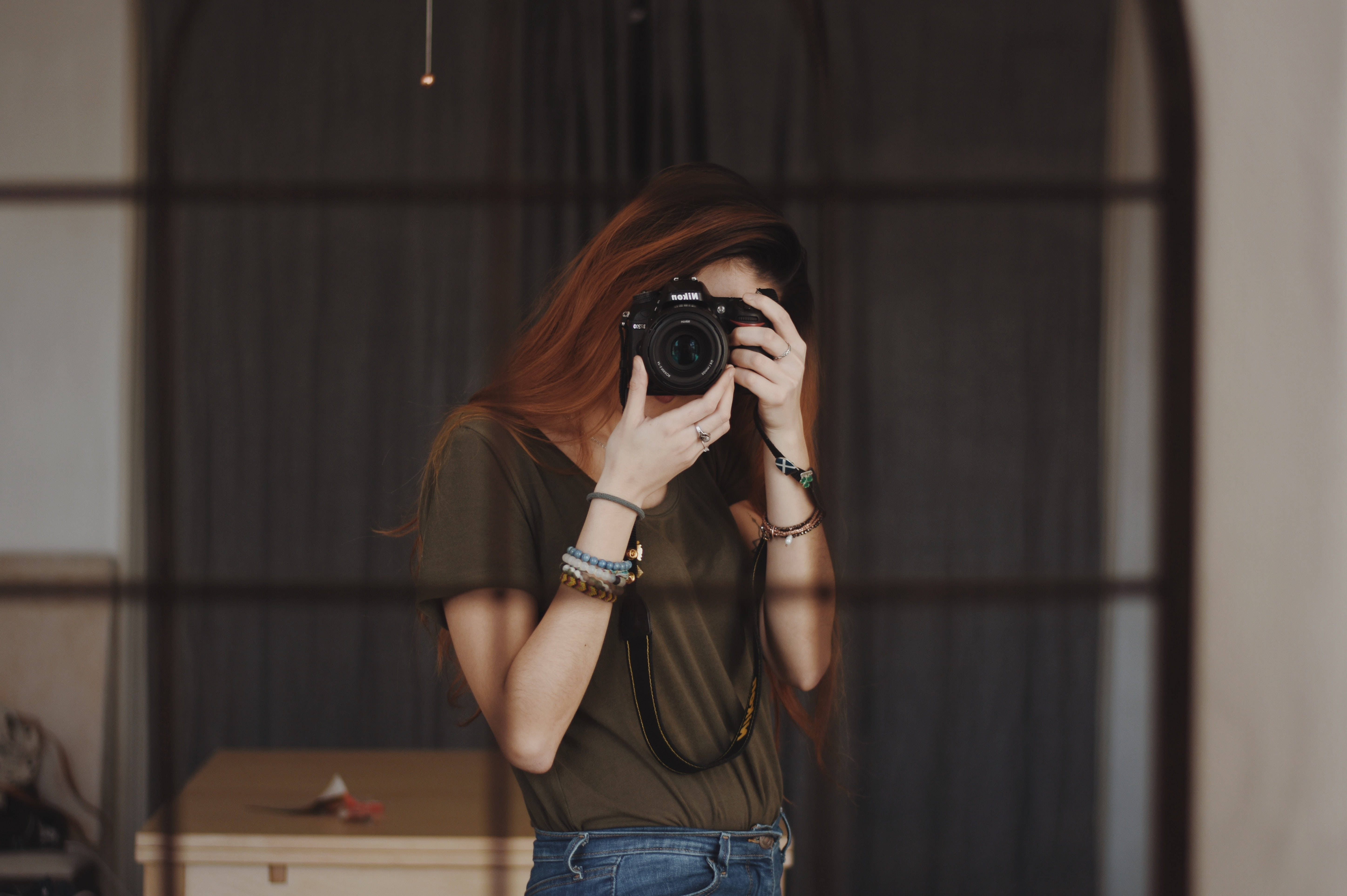 black camera, dark-framed mirror, long red hair, 5K Desktop Wallpaper