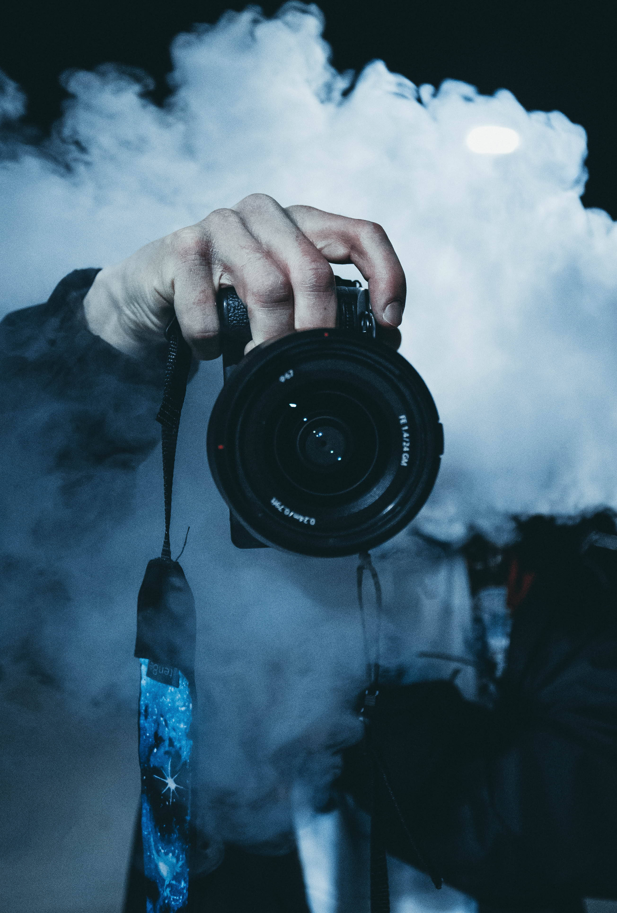 DSLR Camera, hand, thick white smoke, 4K Phone Wallpaper