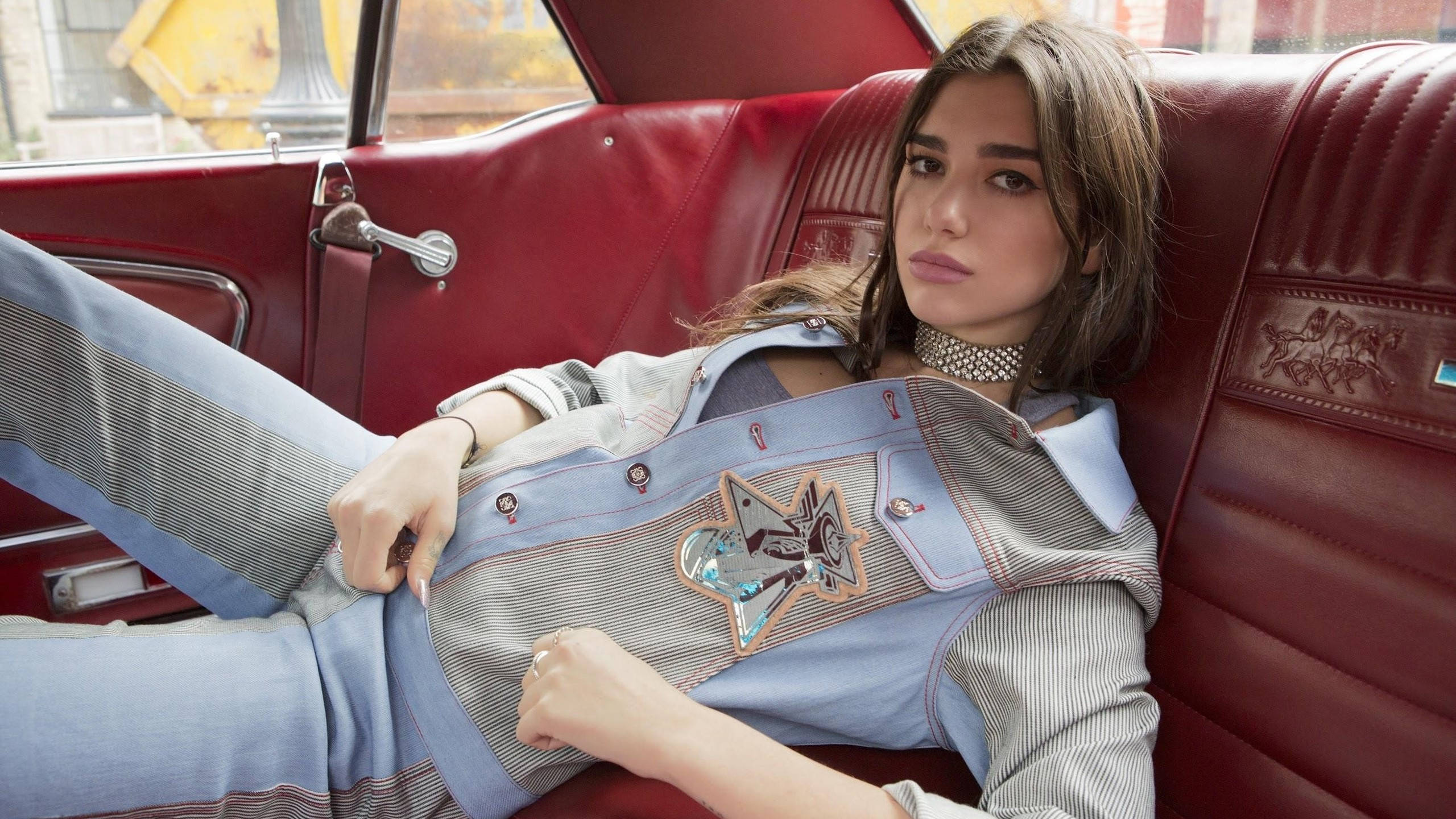 Dua Lipa, red car, red leather backseat, 2K Desktop Wallpaper