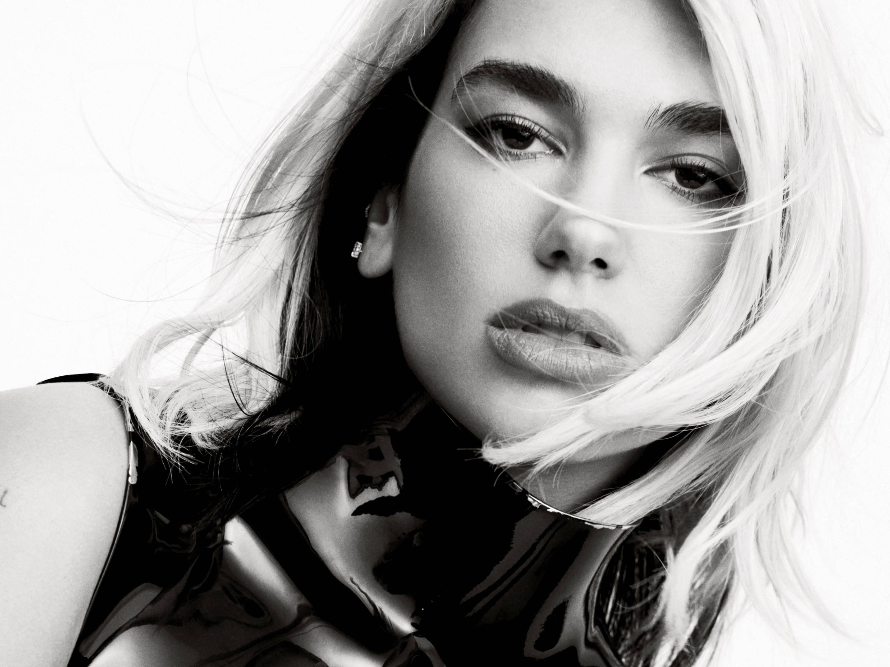 Dua Lipa, black and white portrait, wind-swept hair, 2K Desktop Wallpaper