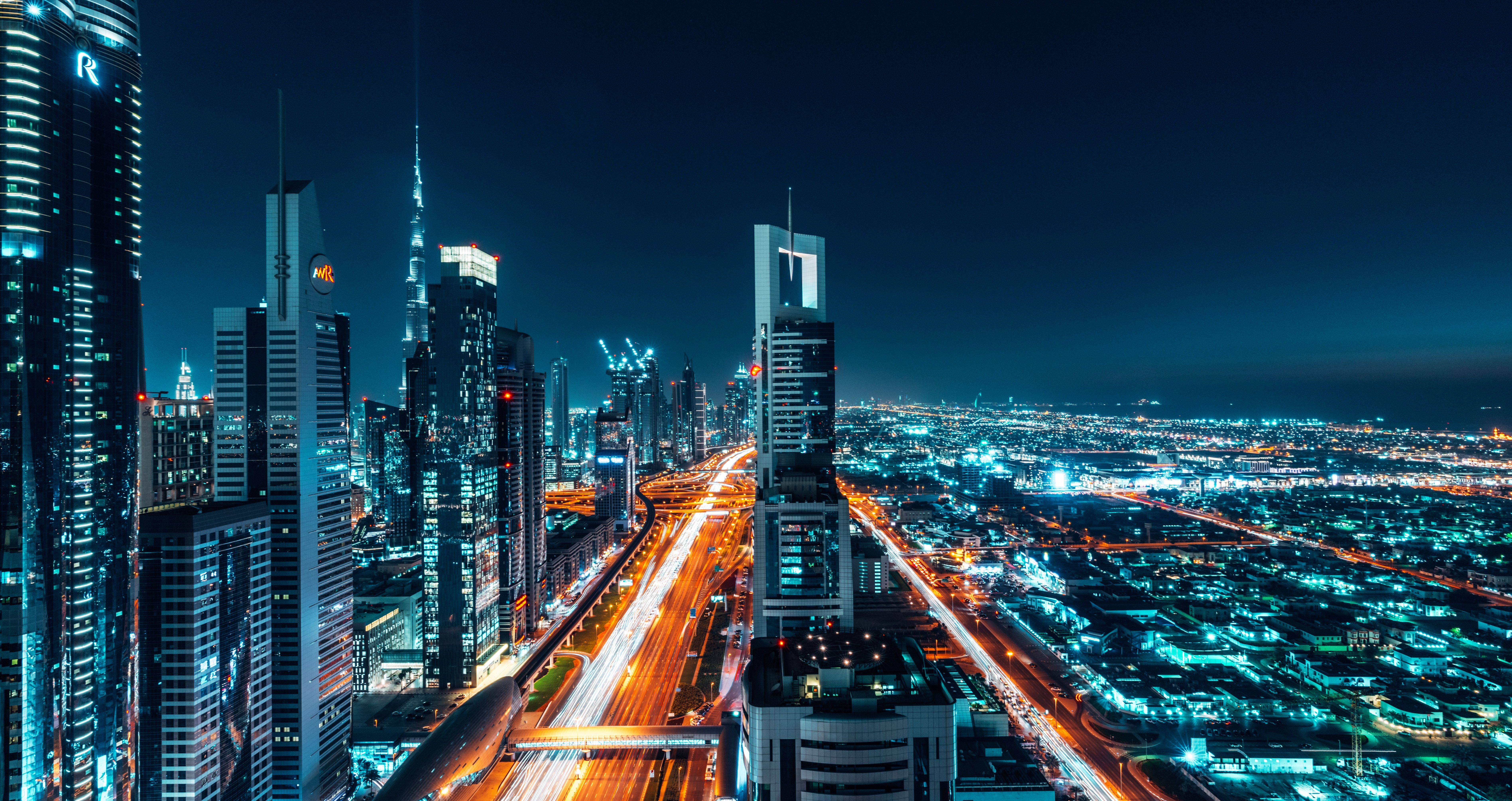 Dubai, nighttime cityscape, towering skyscrapers, 5K Desktop Wallpaper