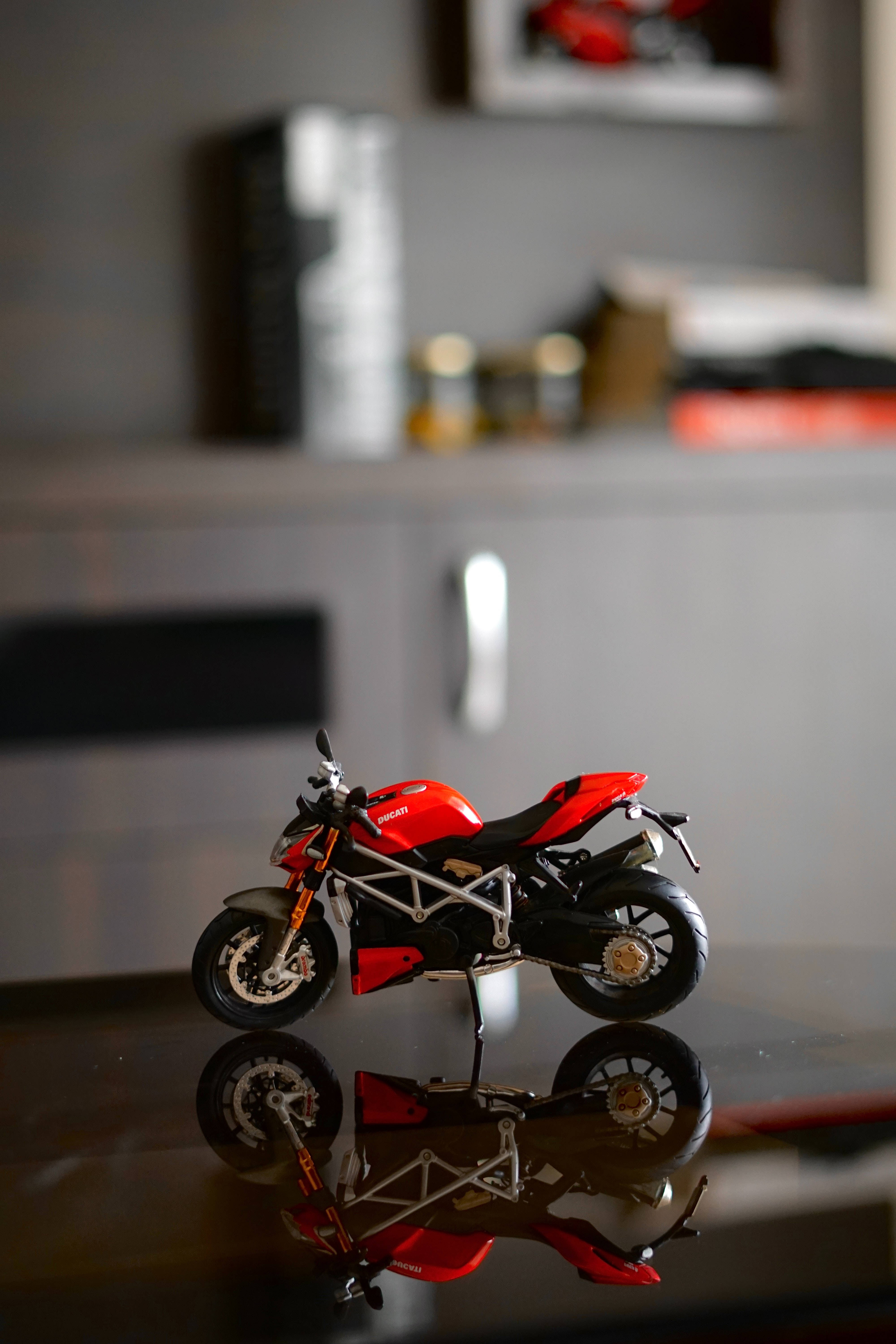 Ducati, red motorcycle model, glossy black surface, 5K Phone Wallpaper