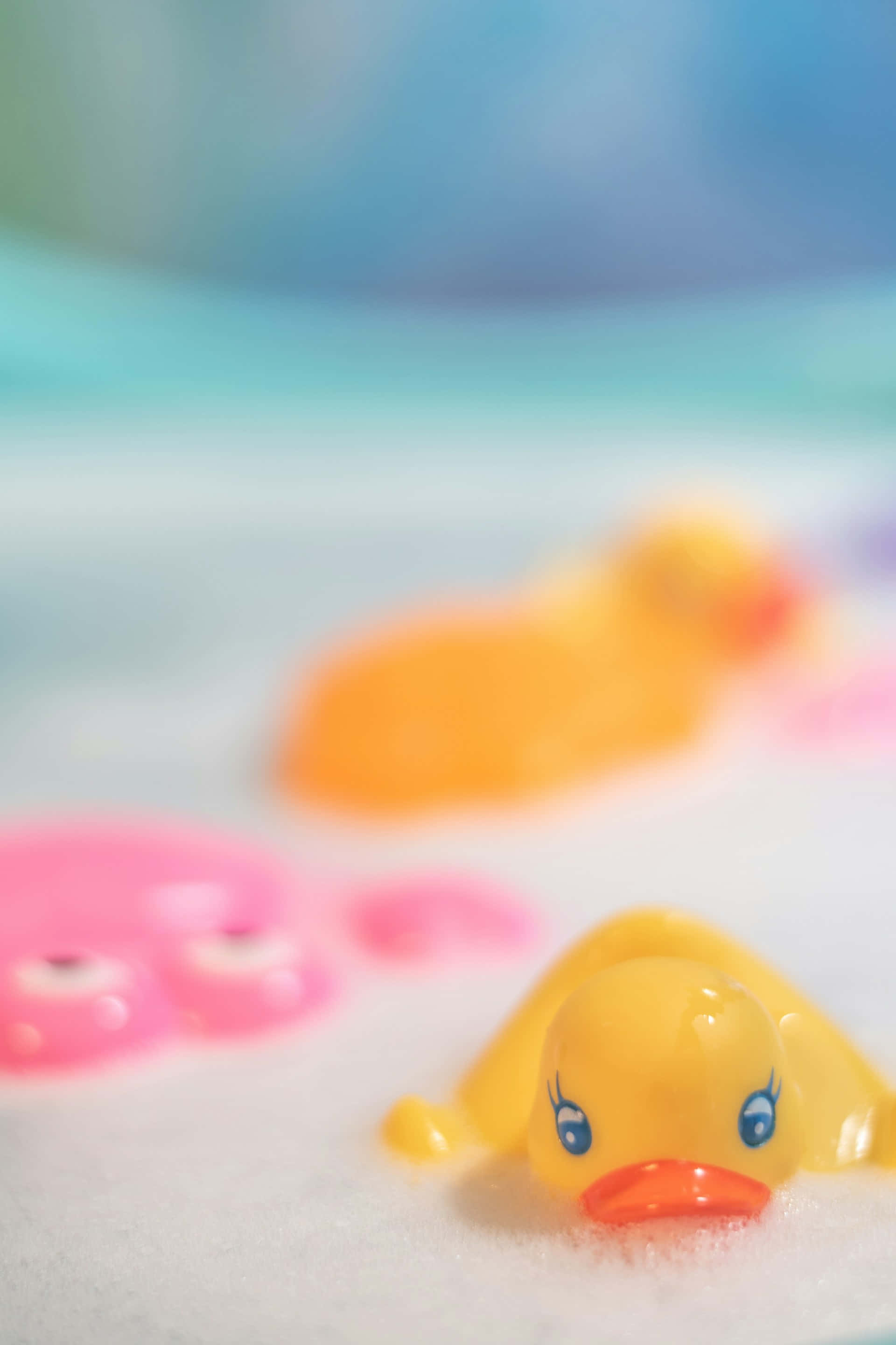 yellow rubber duck, blue eyes, orange beak, 2K Phone Wallpaper