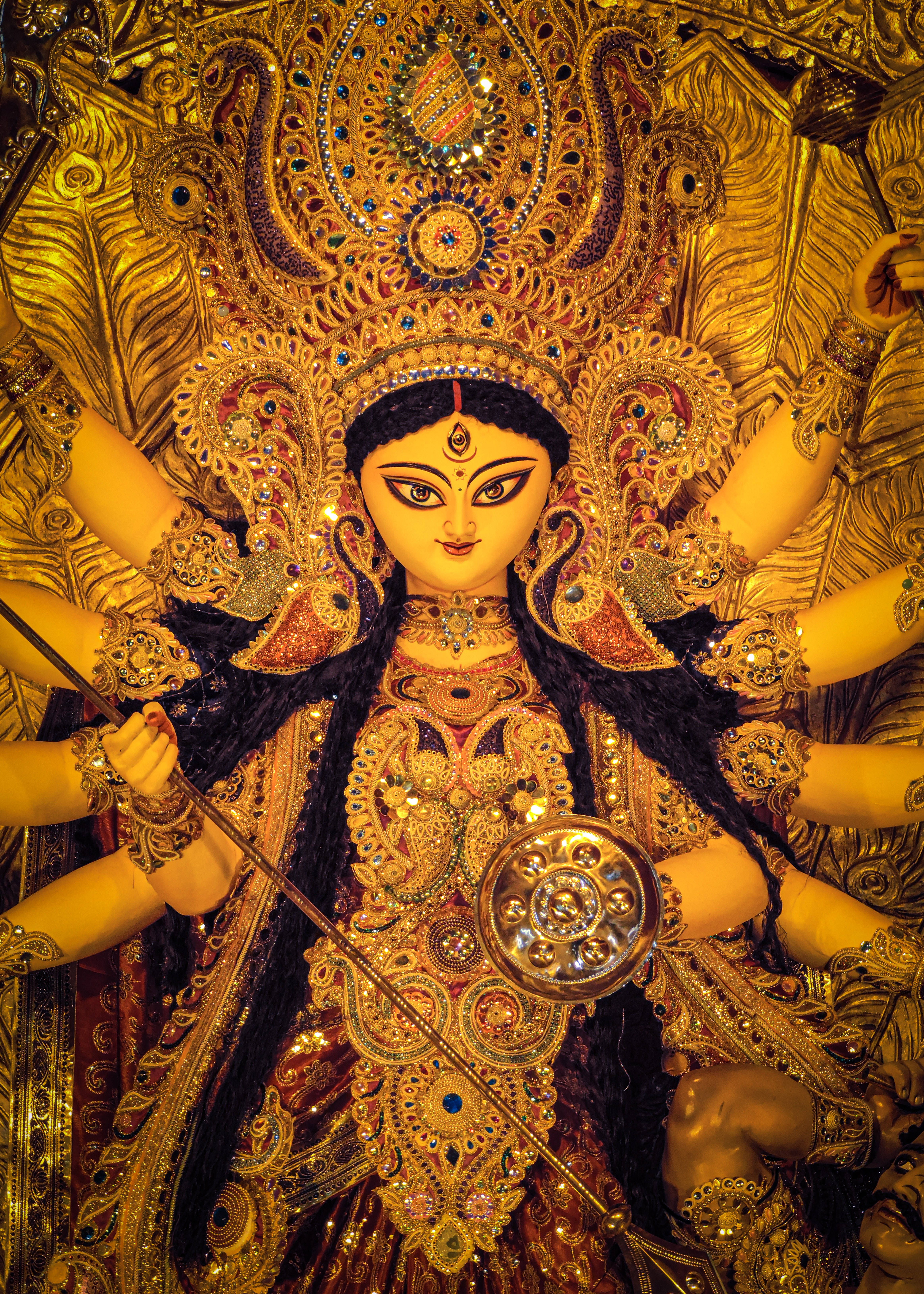 Durga Devi, golden statue, multiple arms, 5K Phone Wallpaper