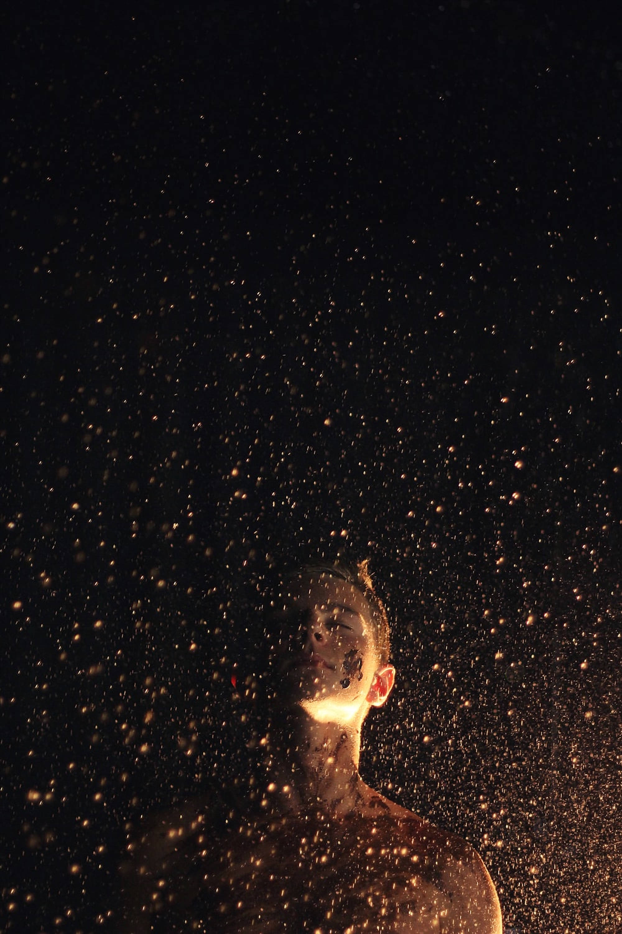 gold dust, golden sparks, black background, 2K Phone Wallpaper