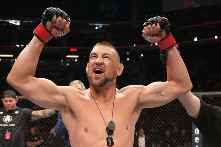 Dustin Jacoby, octagon, fists raised, SD Desktop Wallpaper