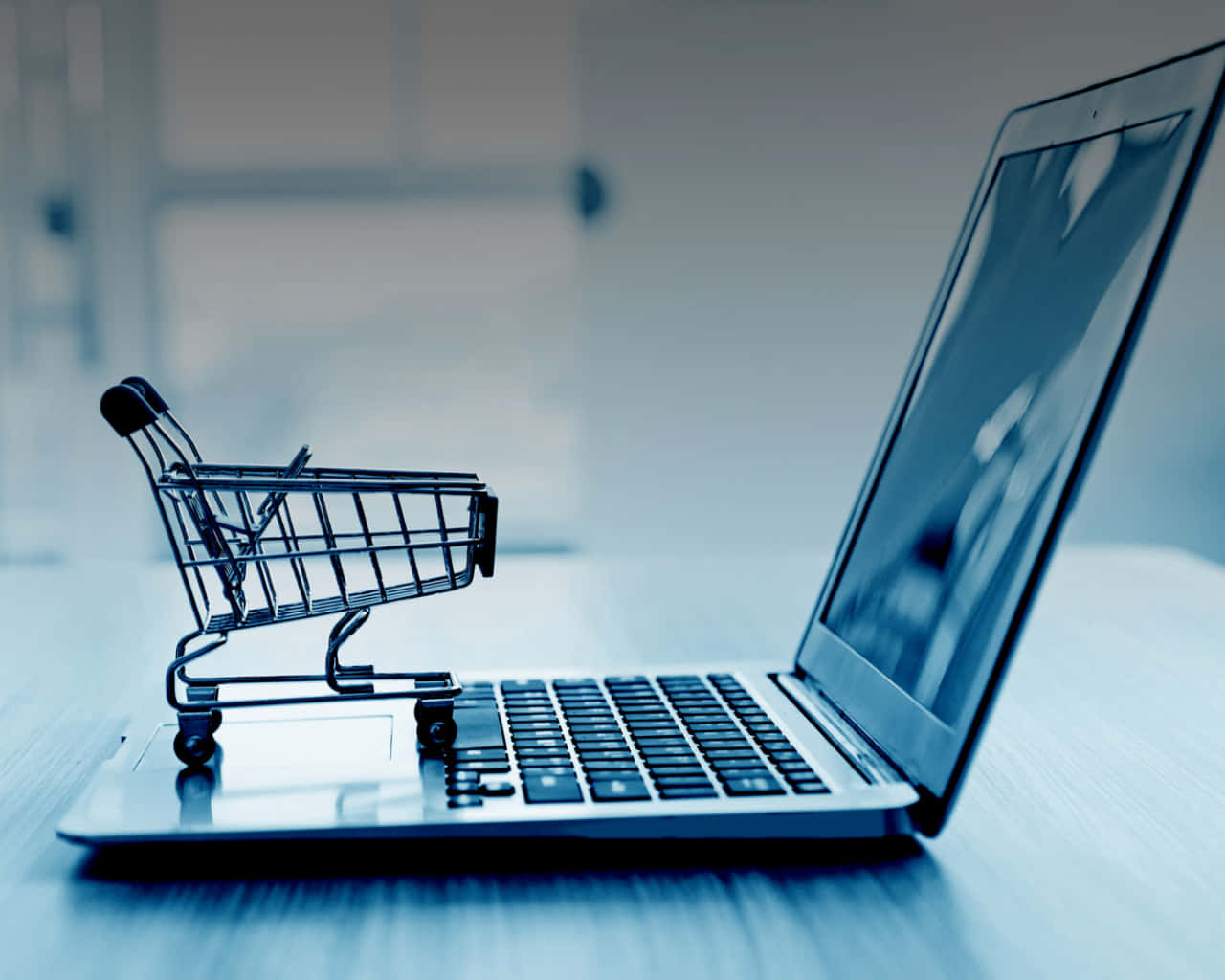 laptop keyboard, cool blue monochrome office setting, miniature shopping cart, HD Desktop Wallpaper