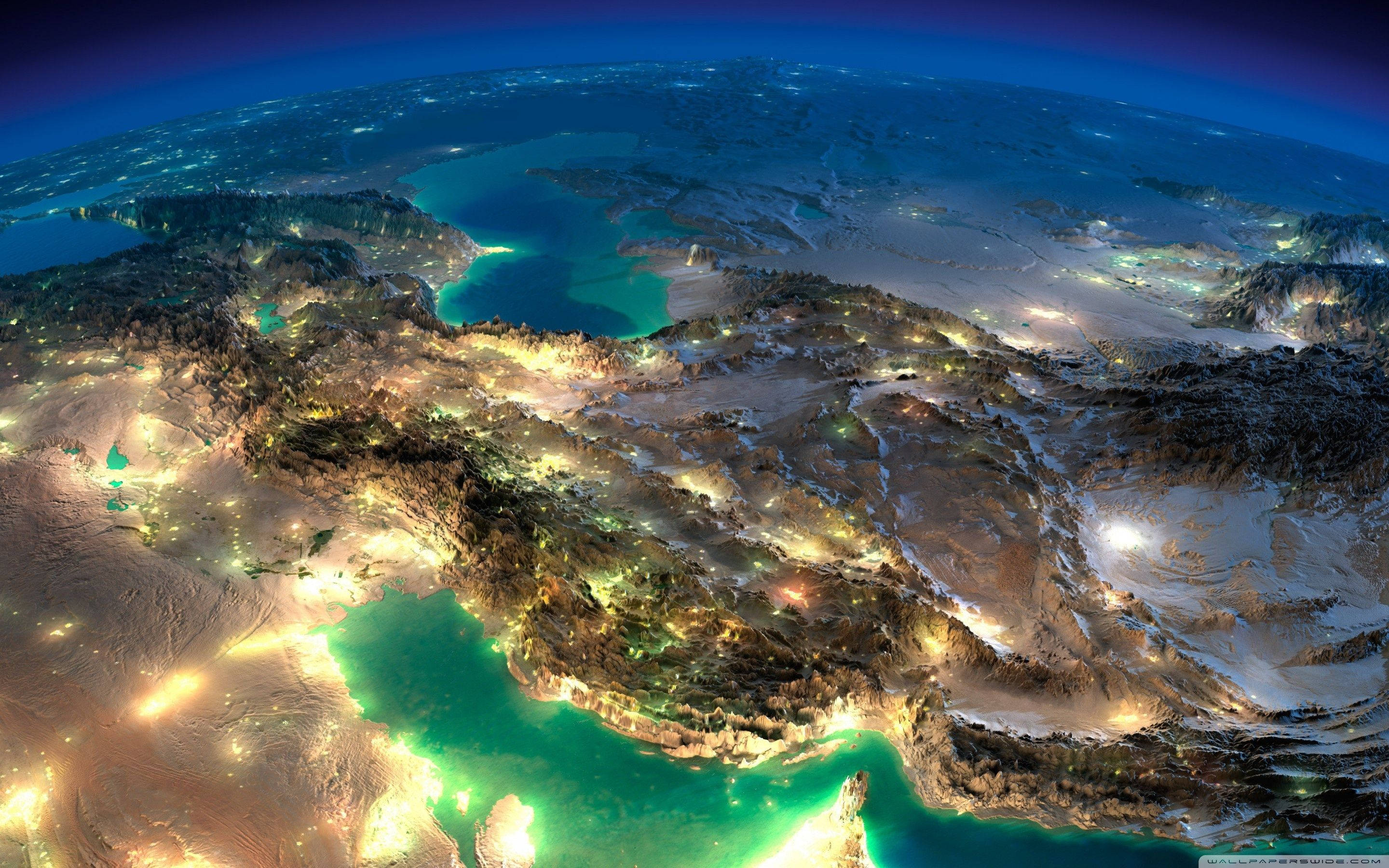 Earth, nighttime satellite view, rugged terrain, 2K Desktop Wallpaper