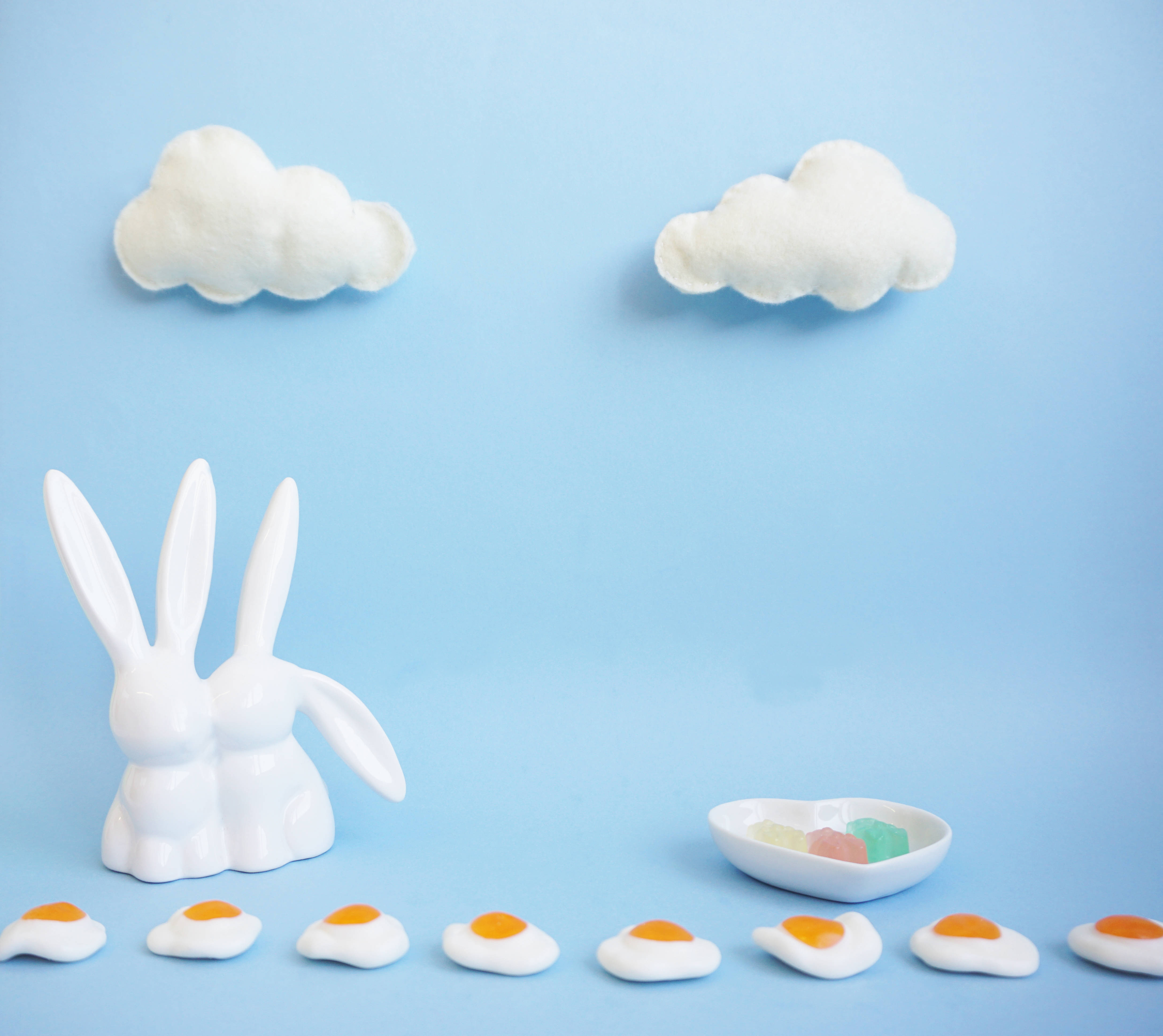 white ceramic bunny figurine, fried egg candies, gummy bears, 4K Desktop Wallpaper