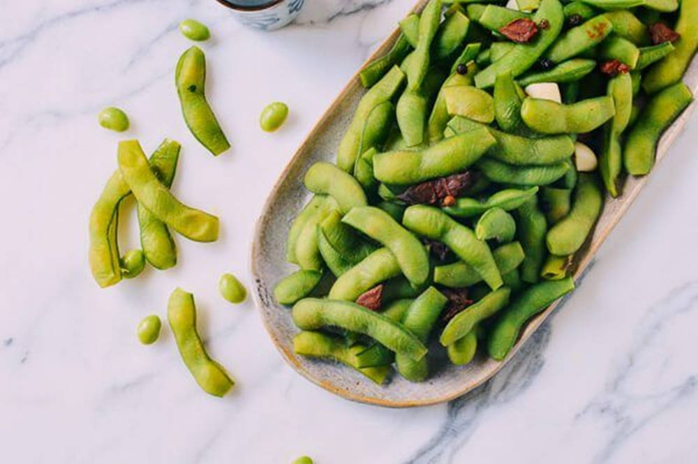 edamame pods, rustic ceramic dish, white marble surface, SD Desktop Wallpaper