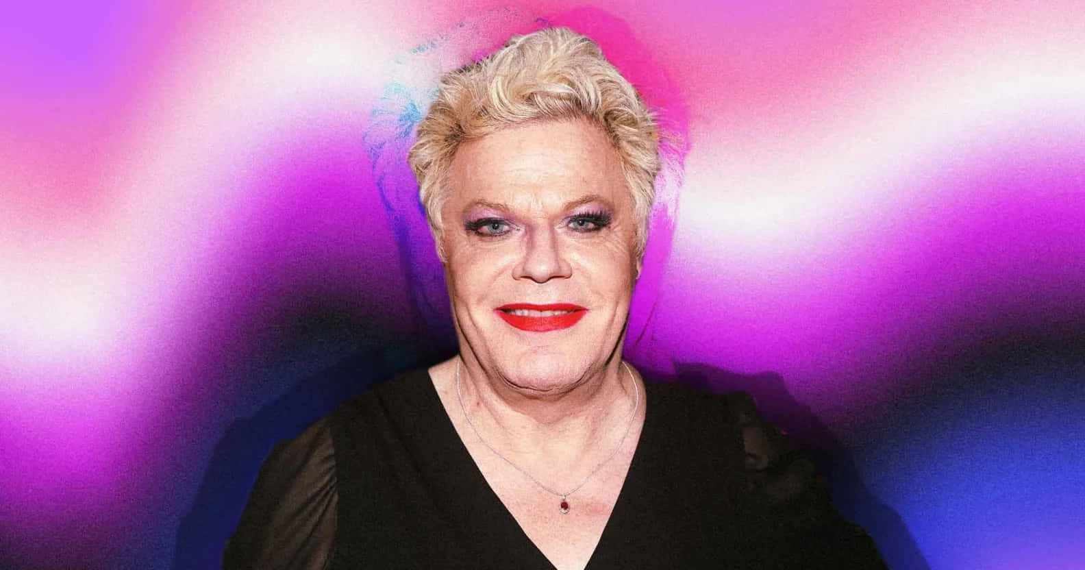 Eddie Izzard, vibrant purple and pink gradient background, short blonde hair, HD Desktop Wallpaper