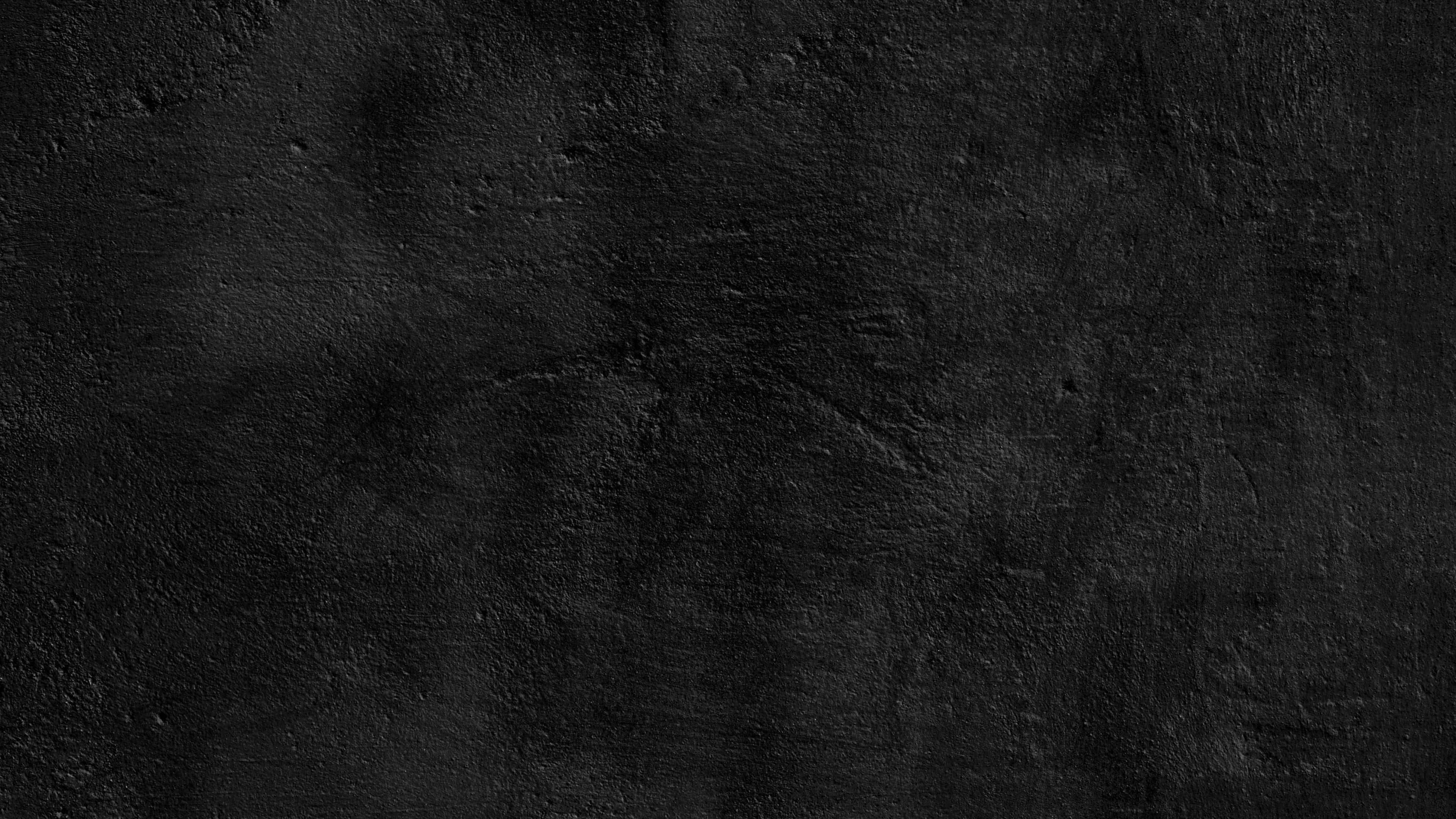 black textured surface, rough, subtle variations in tone and depth, 4K Desktop Wallpaper