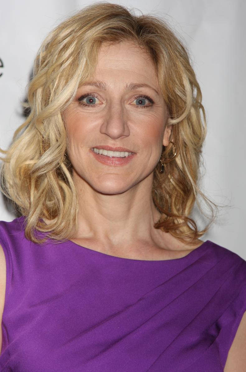 Edie Falco, vibrant purple sleeveless dress, wavy blonde hair, SD Phone Wallpaper