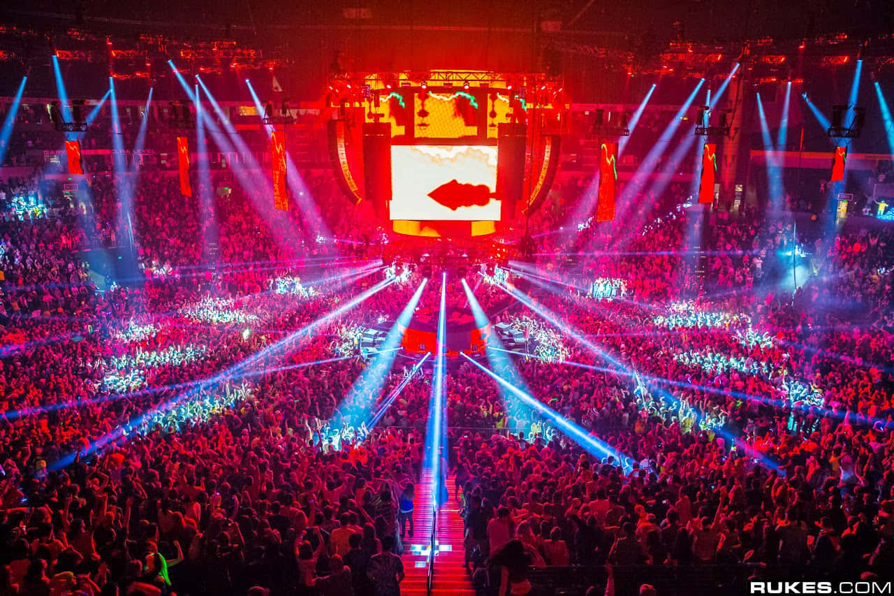 EDM scene, vibrant red and blue laser lights, packed indoor concert arena, HD Desktop Wallpaper