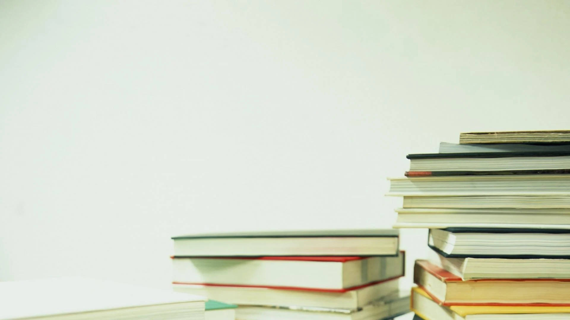 Education, stacks of colorful books, plain white surface, Full HD Desktop Wallpaper