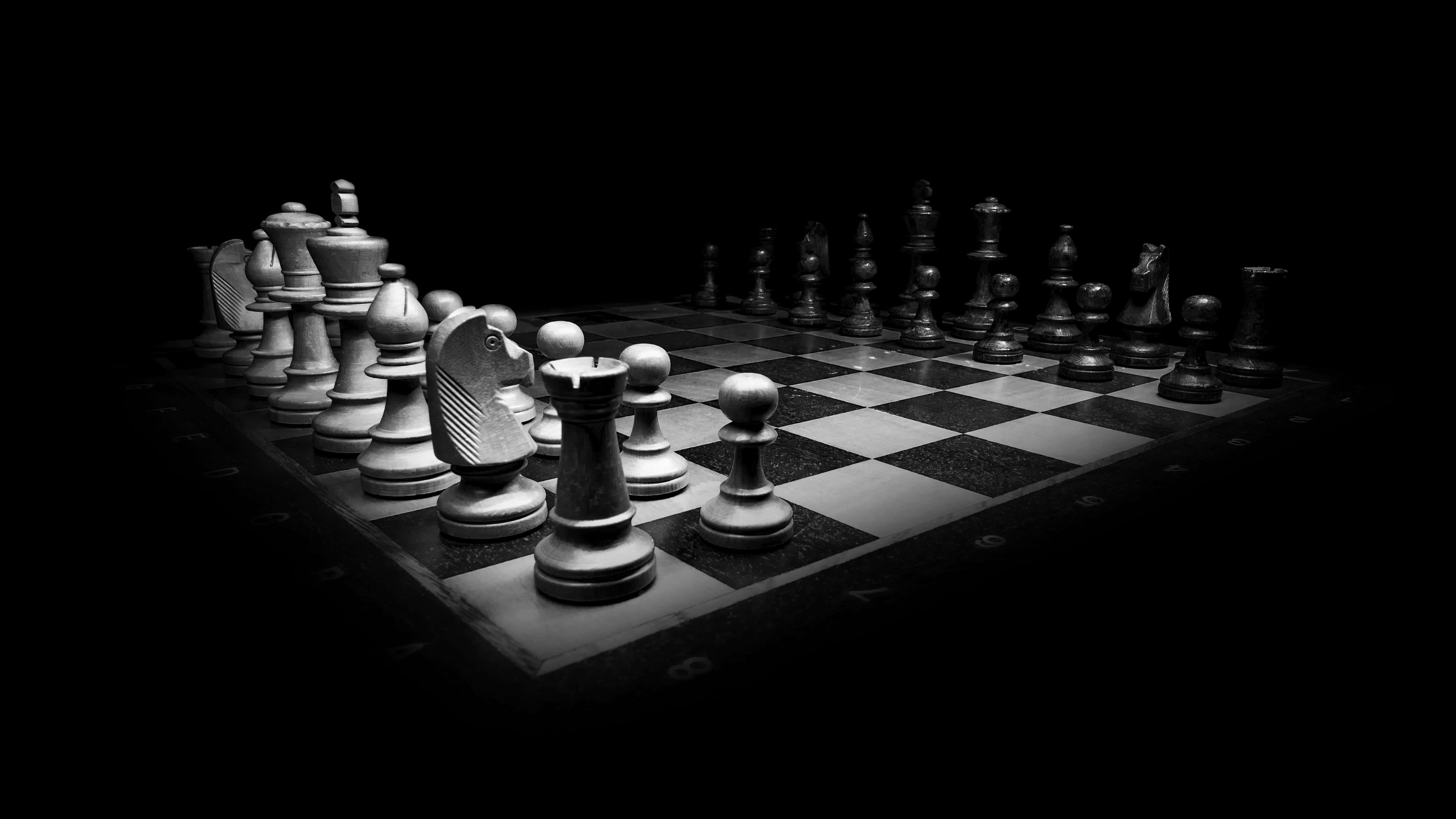 black and white chessboard, chess pieces, focused lighting, 4K Desktop Wallpaper