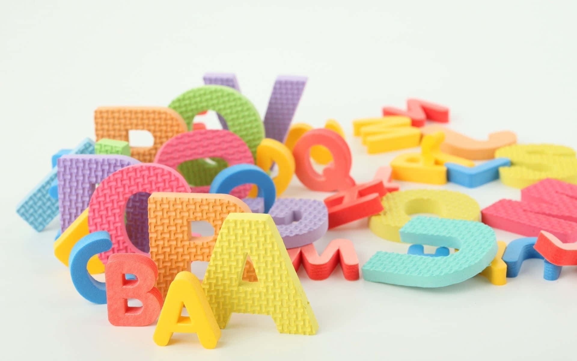educational games, colorful foam alphabet letters, white surface, Full HD Desktop Wallpaper